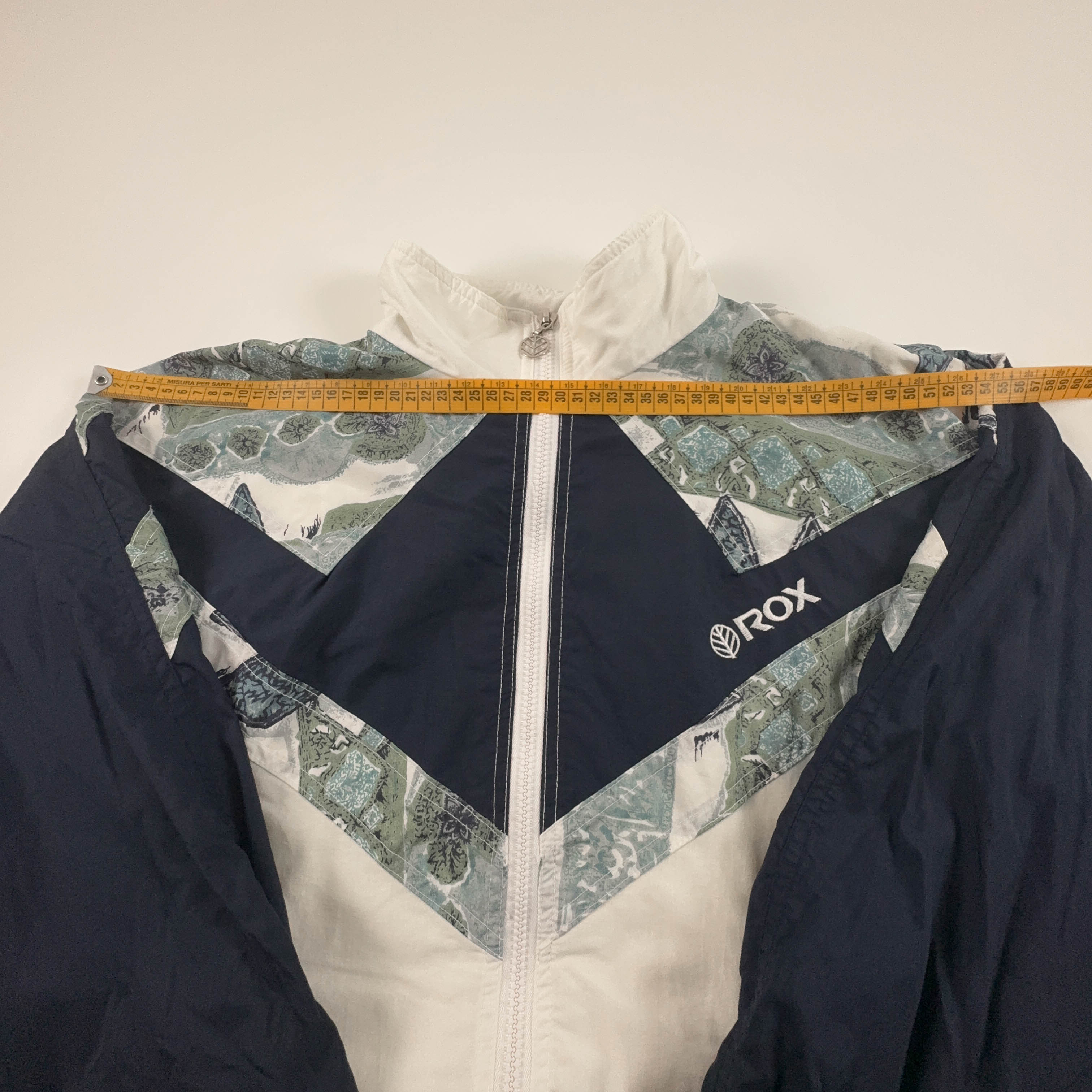 Giacca a vento Vintage bianca e blu a fantasia con zip anni 80 90 - Taglia S uomo