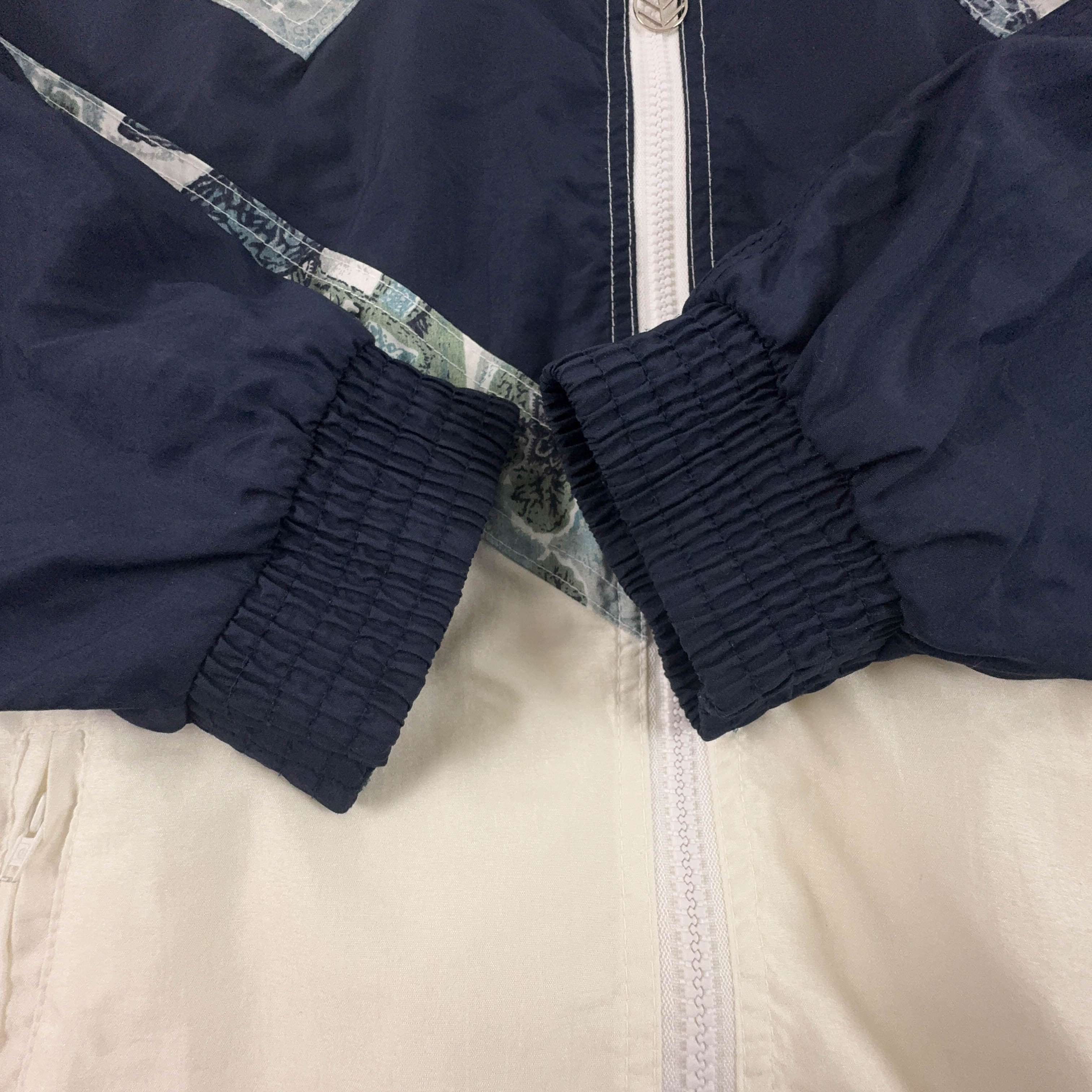 Giacca a vento Vintage bianca e blu a fantasia con zip anni 80 90 - Taglia S uomo