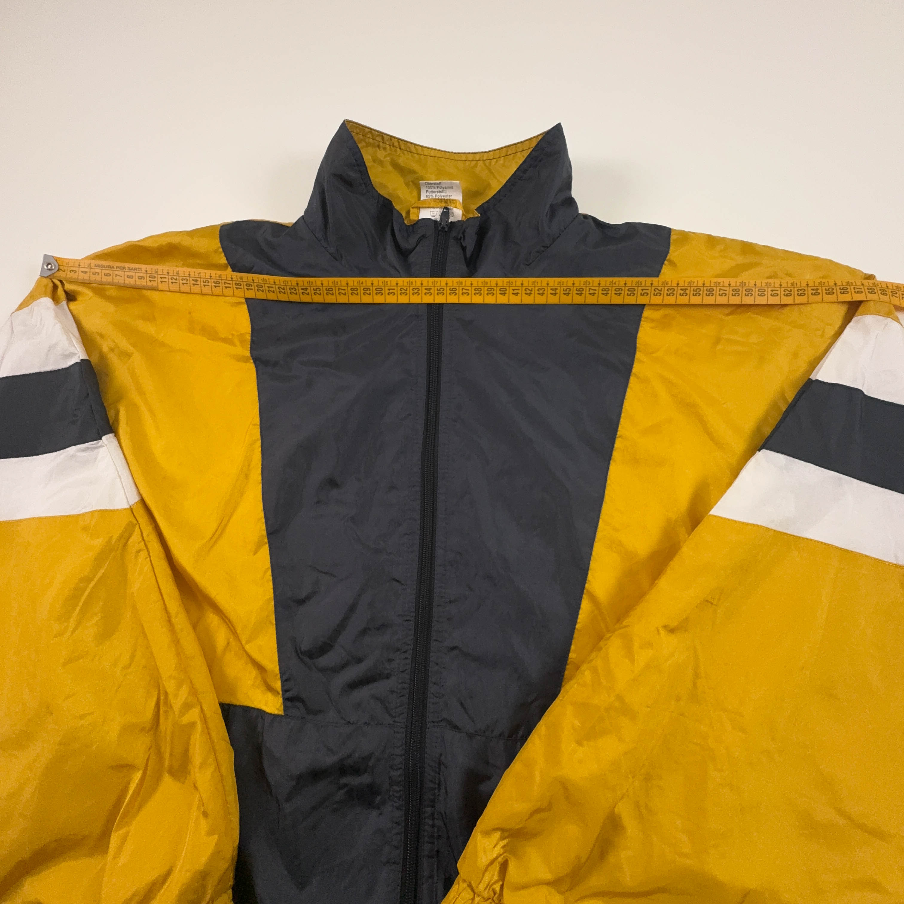 Giacca a vento Vintage gialla e nera geometrica con zip anni 80 90 - Taglia XL/XXL uomo