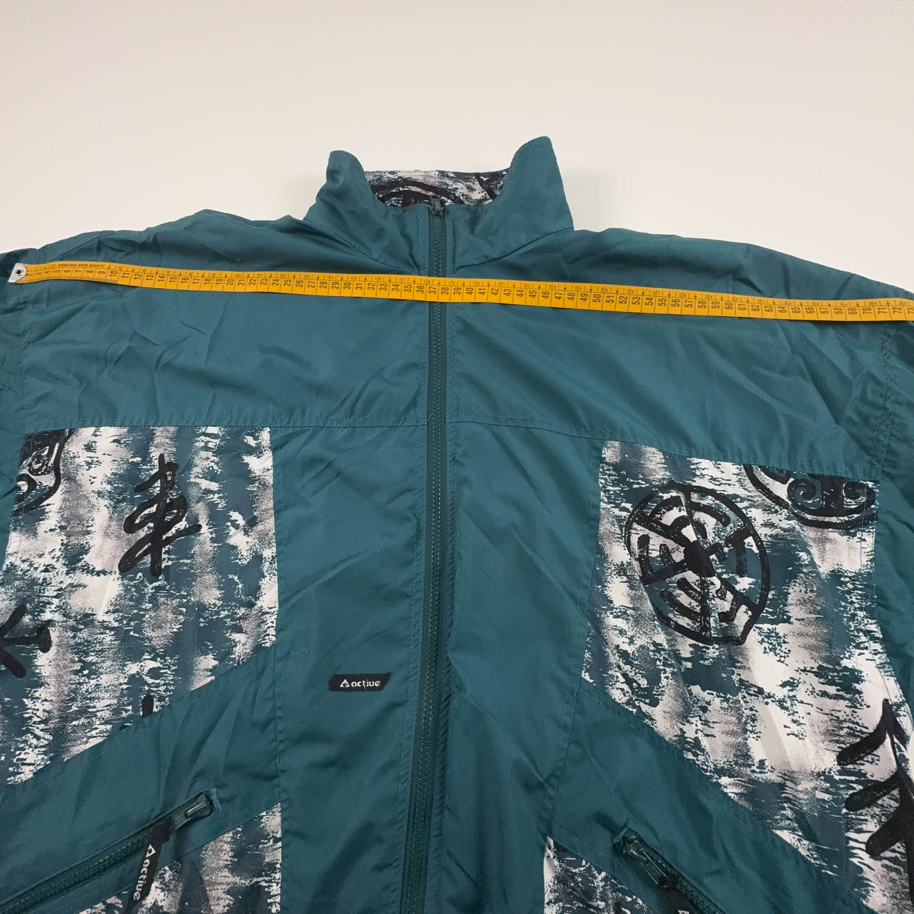 Giacca a vento Vintage verde acqua a fantasia con zip anni 80 90 - Taglia XL uomo
