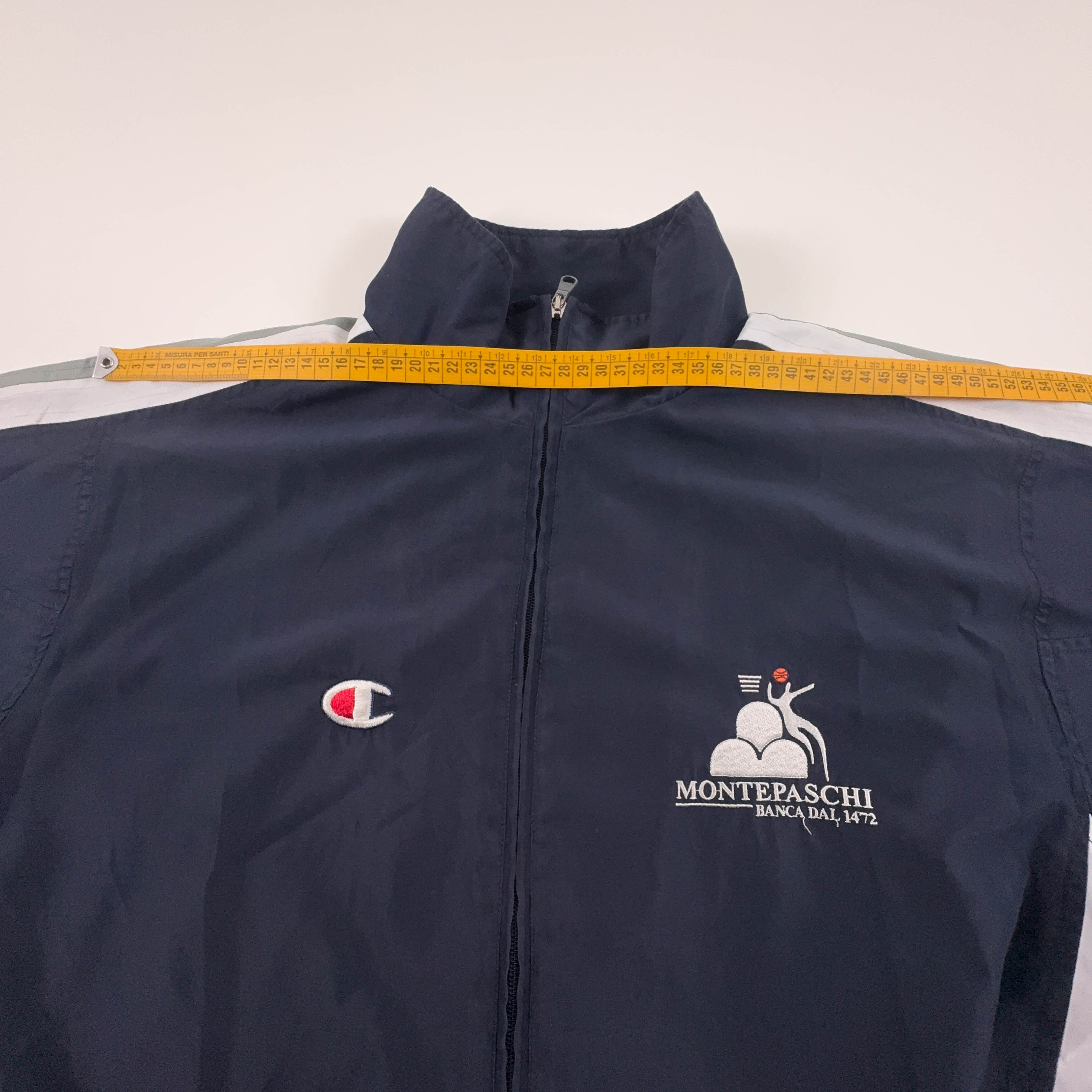 Giacca a vento Champion Vintage blu e bianca con zip anni 80 90 - Taglia M/L uomo