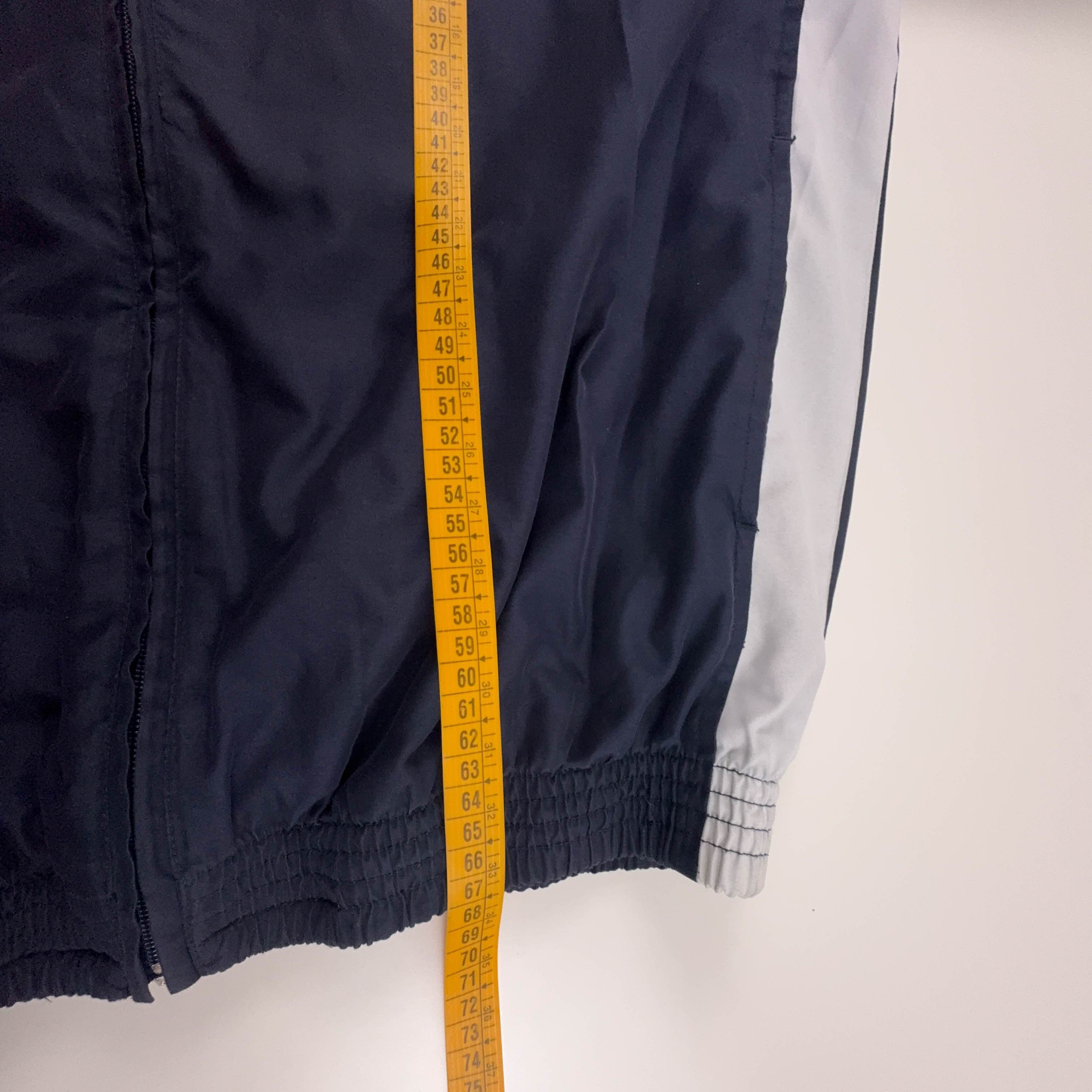 Giacca a vento Champion Vintage blu e bianca con zip anni 80 90 - Taglia M/L uomo