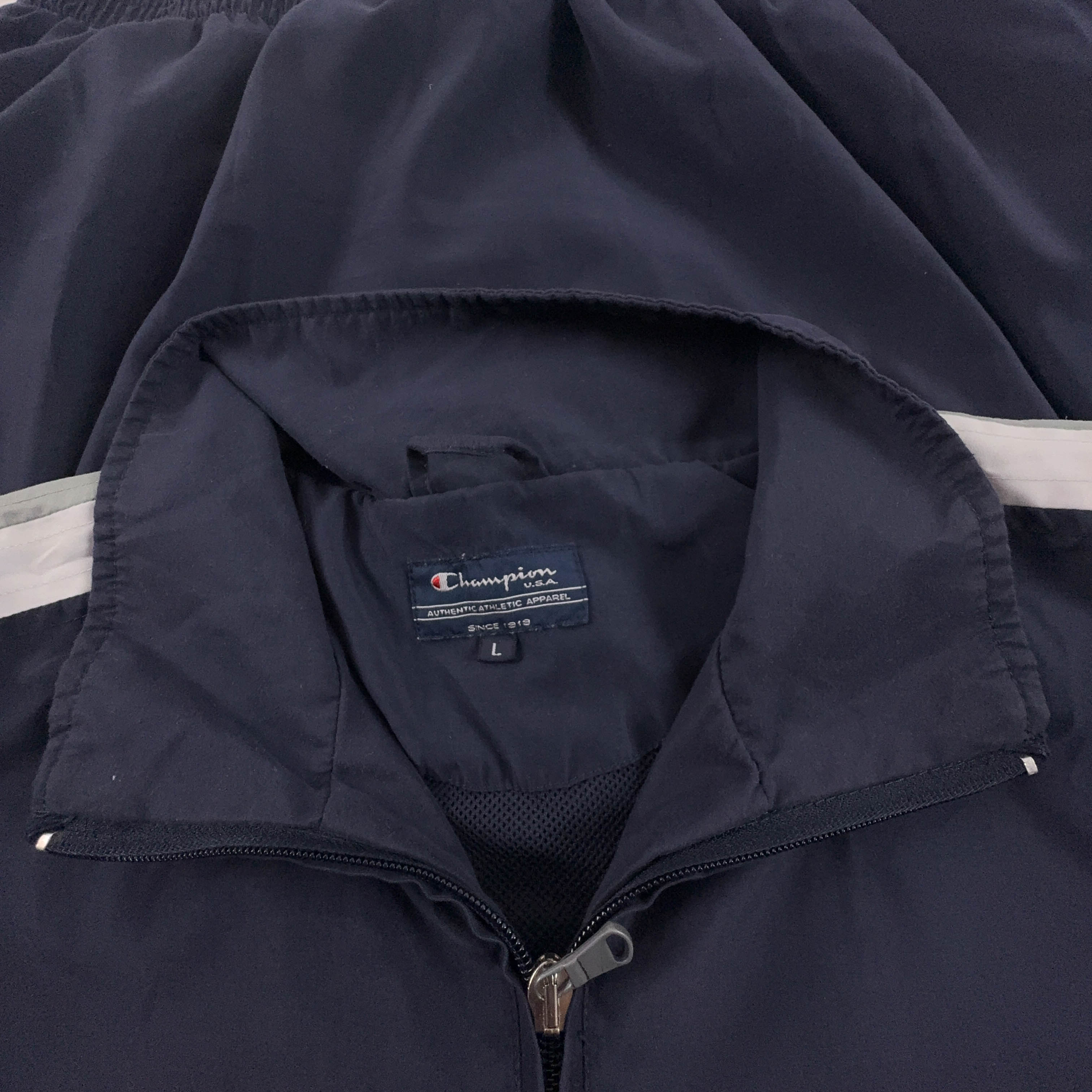 Giacca a vento Champion Vintage blu e bianca con zip anni 80 90 - Taglia M/L uomo