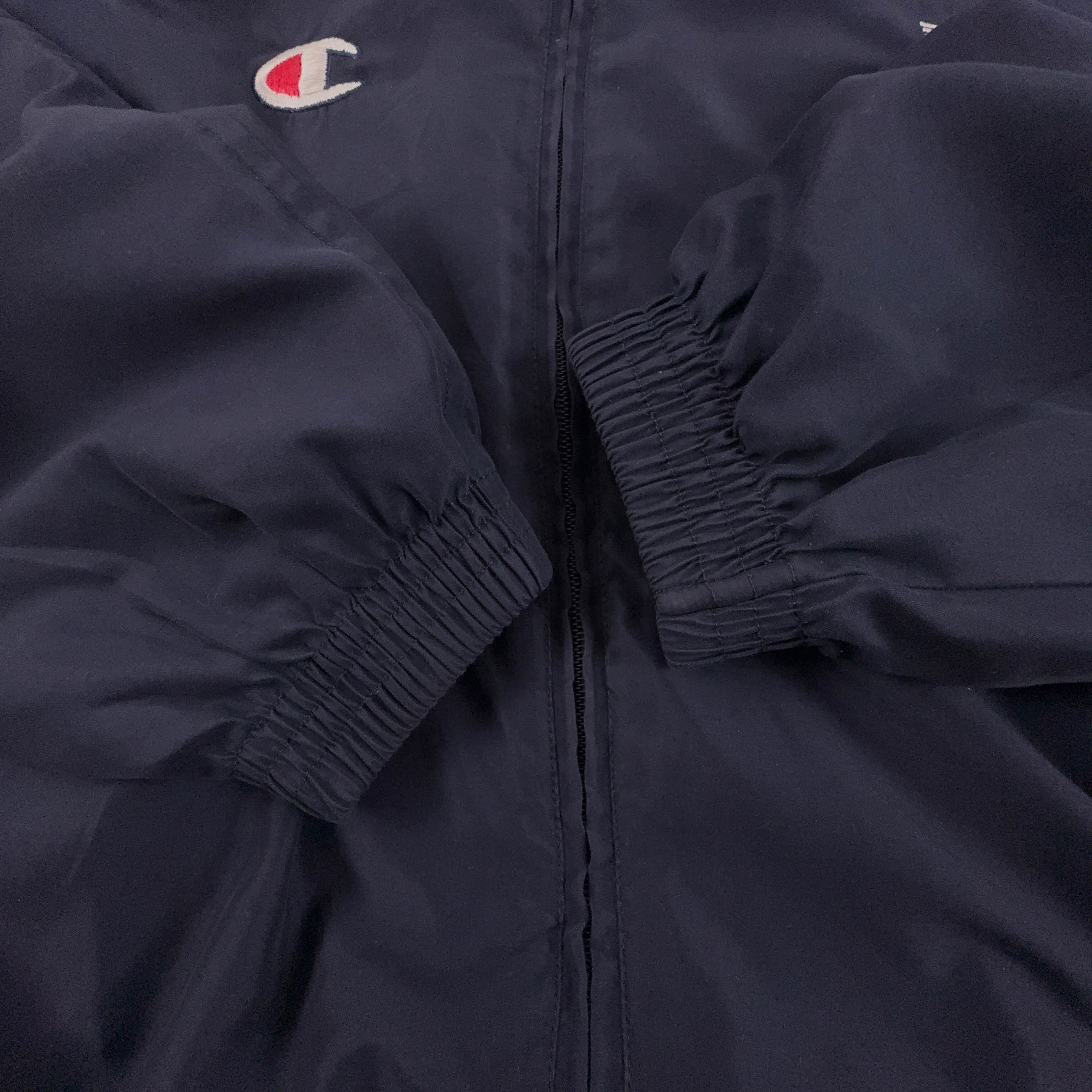 Giacca a vento Champion Vintage blu e bianca con zip anni 80 90 - Taglia M/L uomo