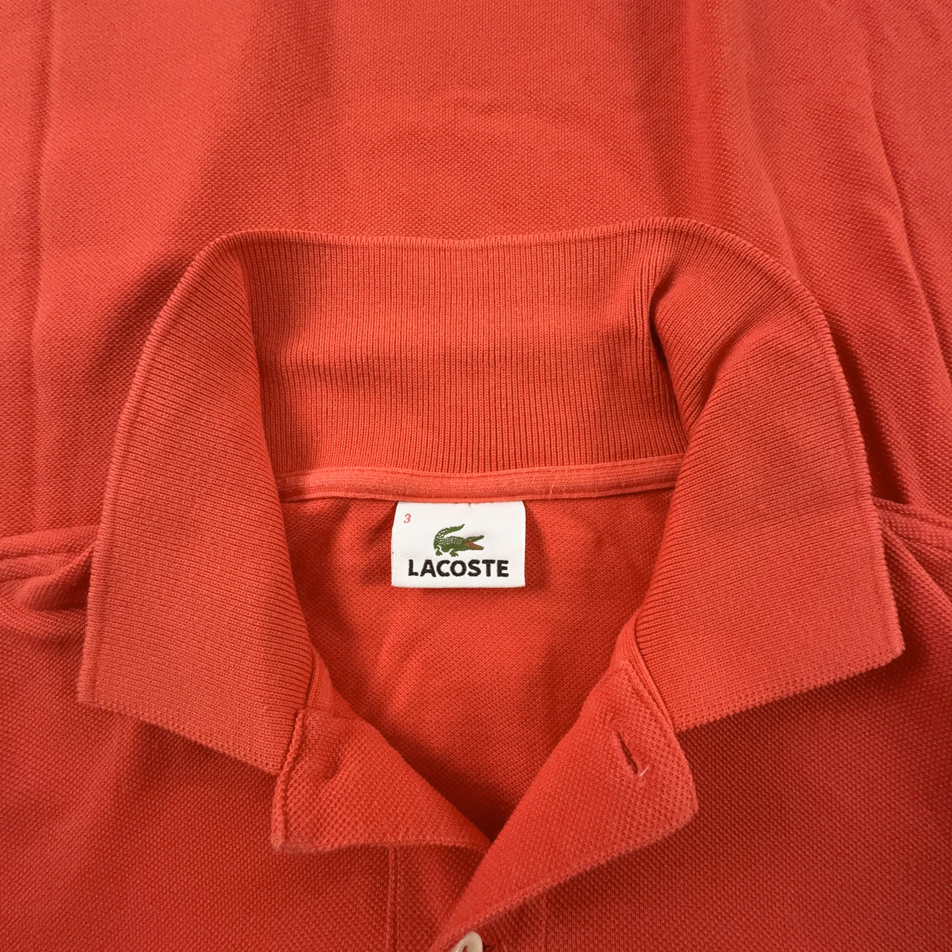 Polo Lacoste arancione a tinta unita - Taglia M/L uomo