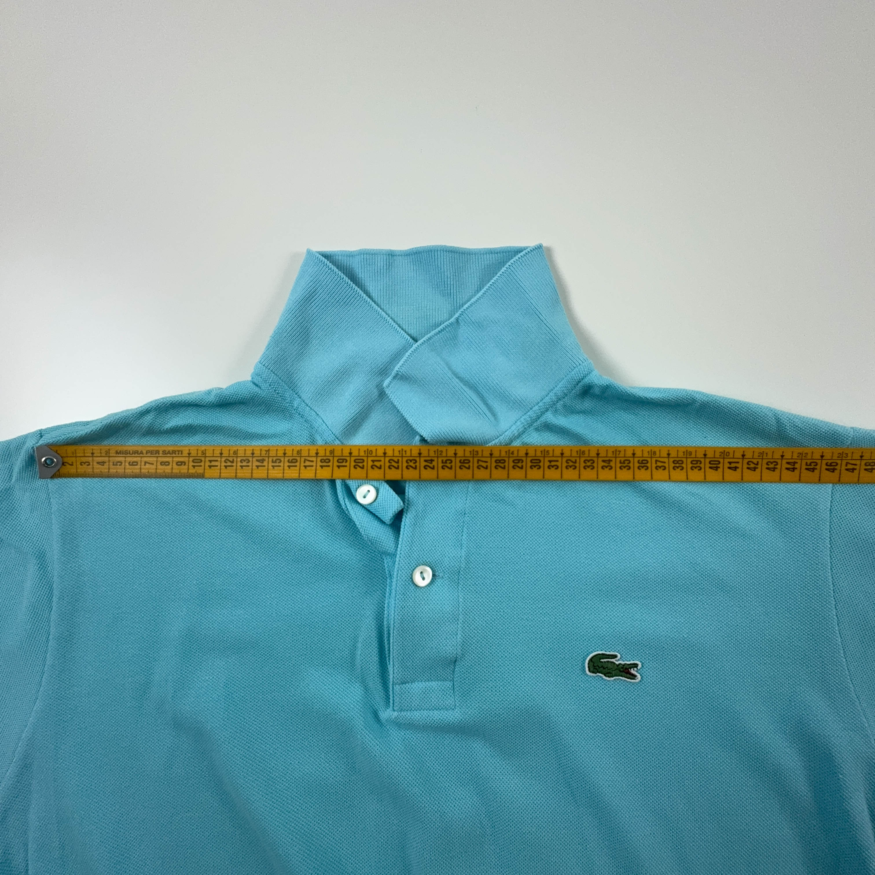 Polo Lacoste azzurra a tinta unita - Taglia 4 uomo