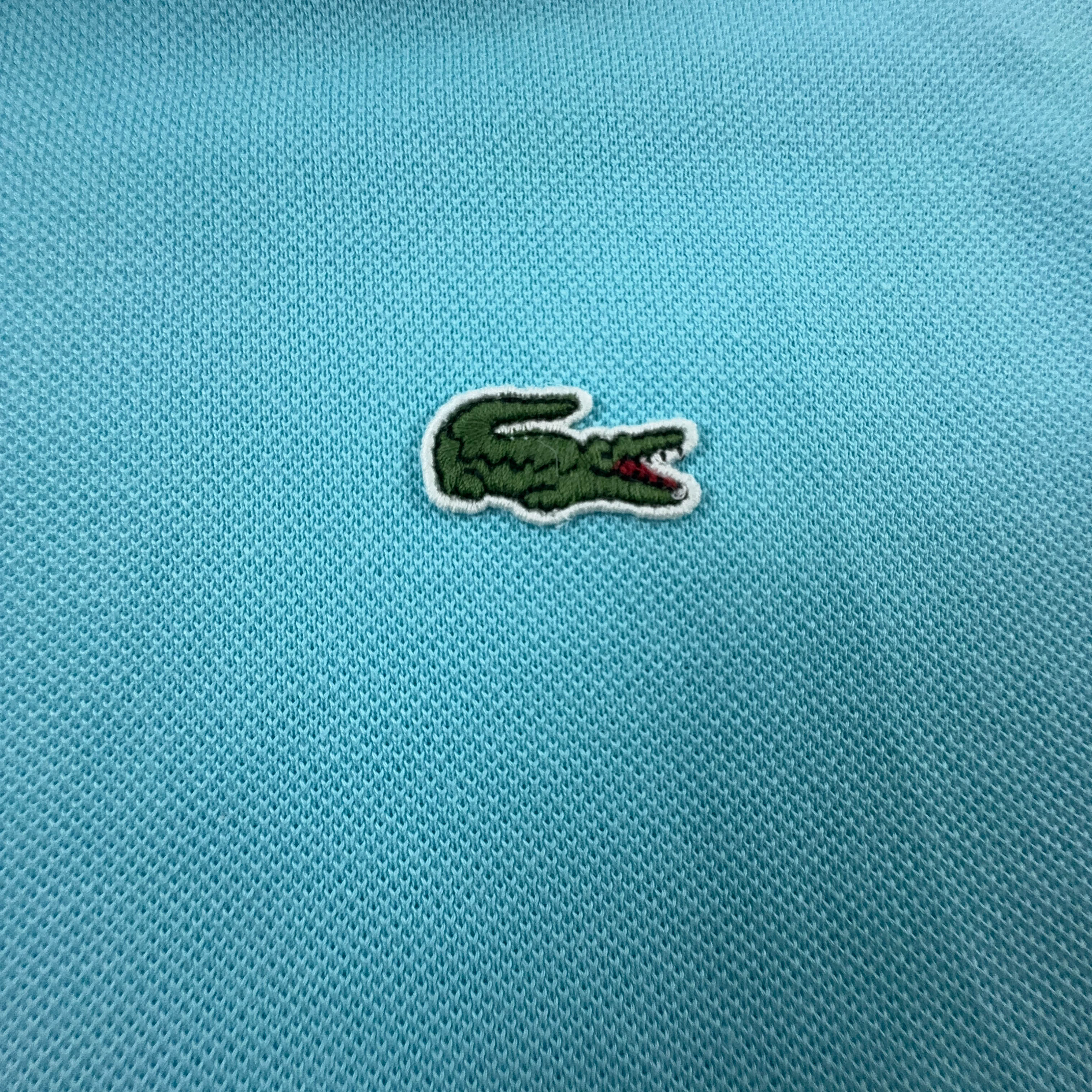 Polo Lacoste azzurra a tinta unita - Taglia 4 uomo