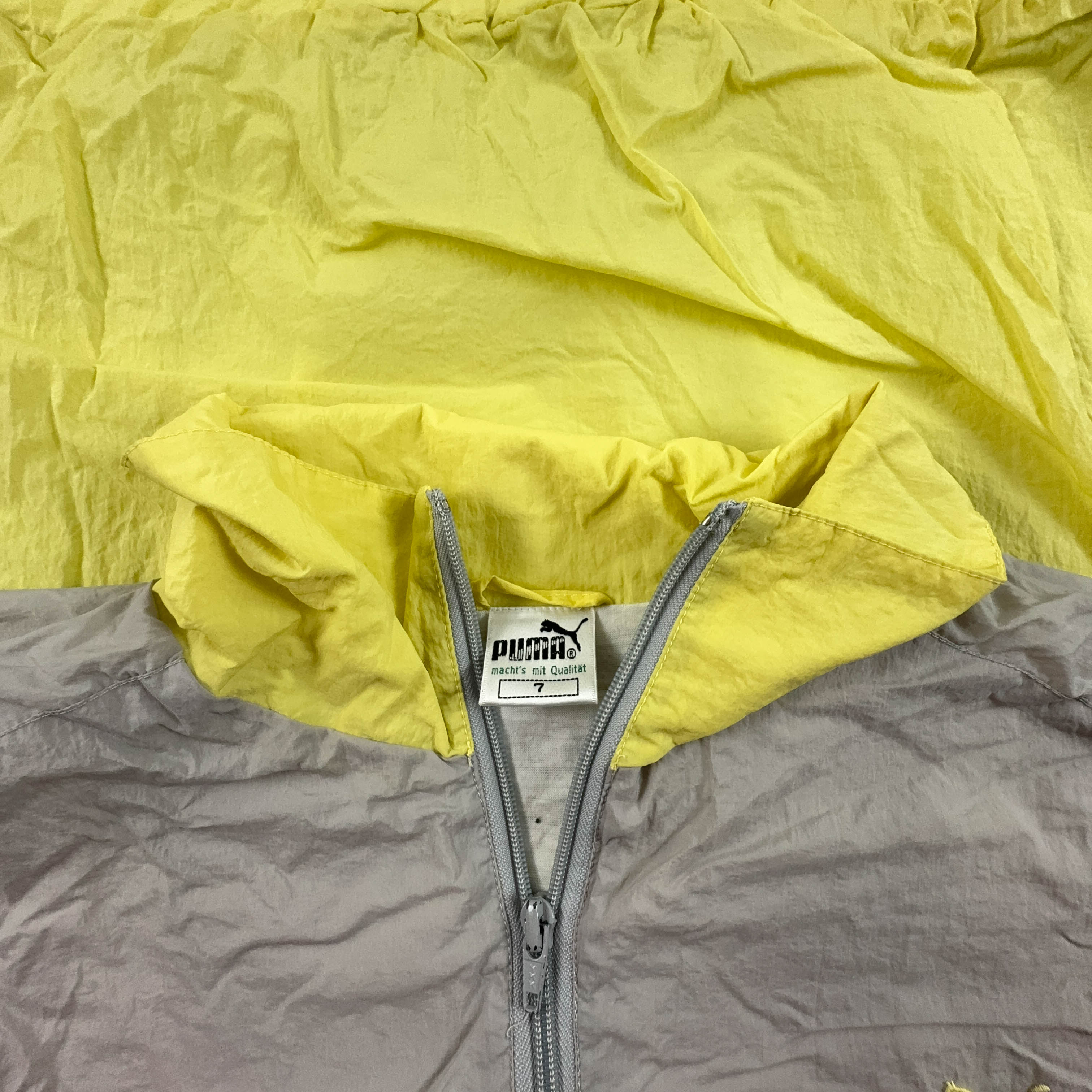 Giacca a vento Puma Vintage grigia e gialla con zip anni 90 - Taglia M/L uomo