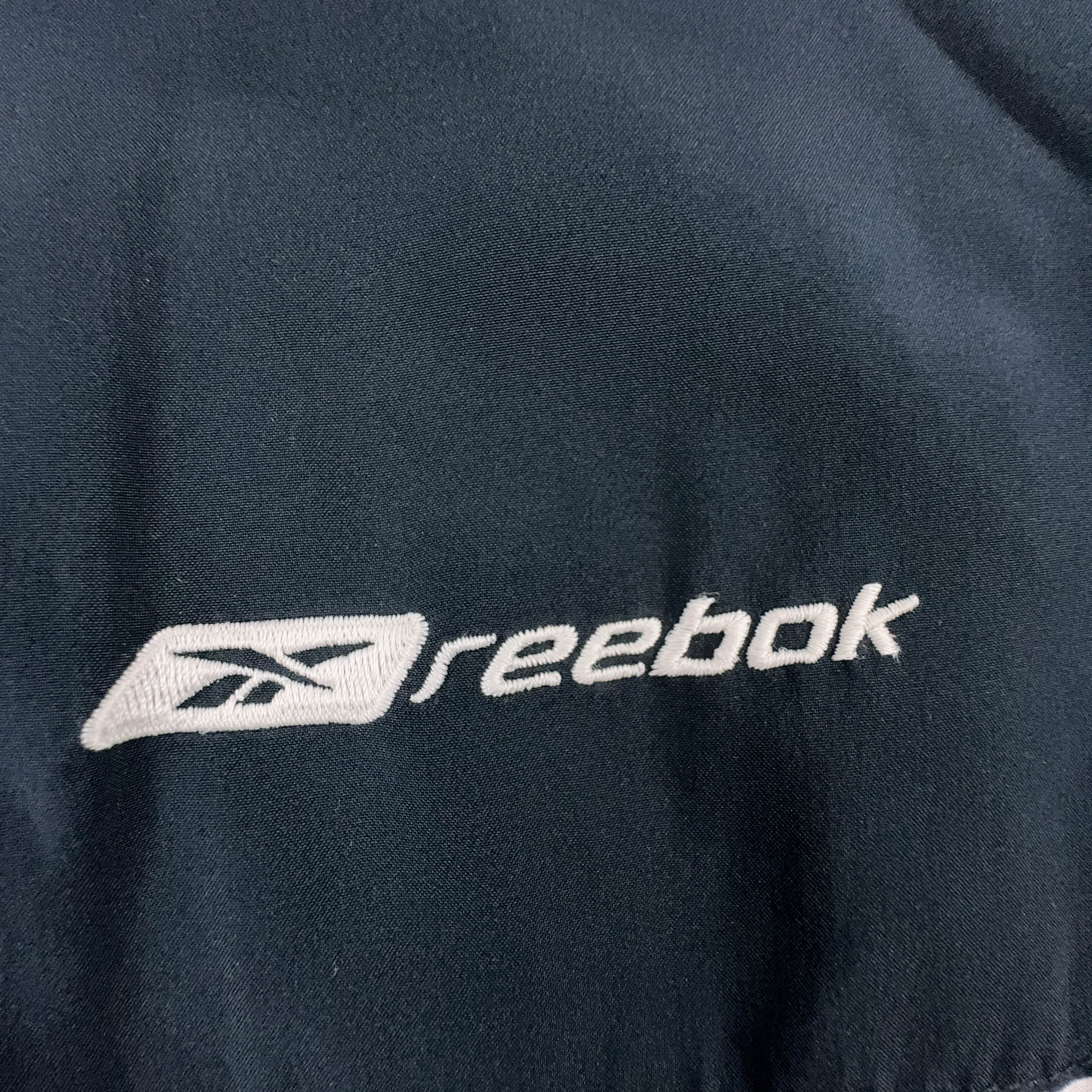 Giacca a vento Reebok Vintage grigia e blu con zip anni 2000 - Taglia XL uomo