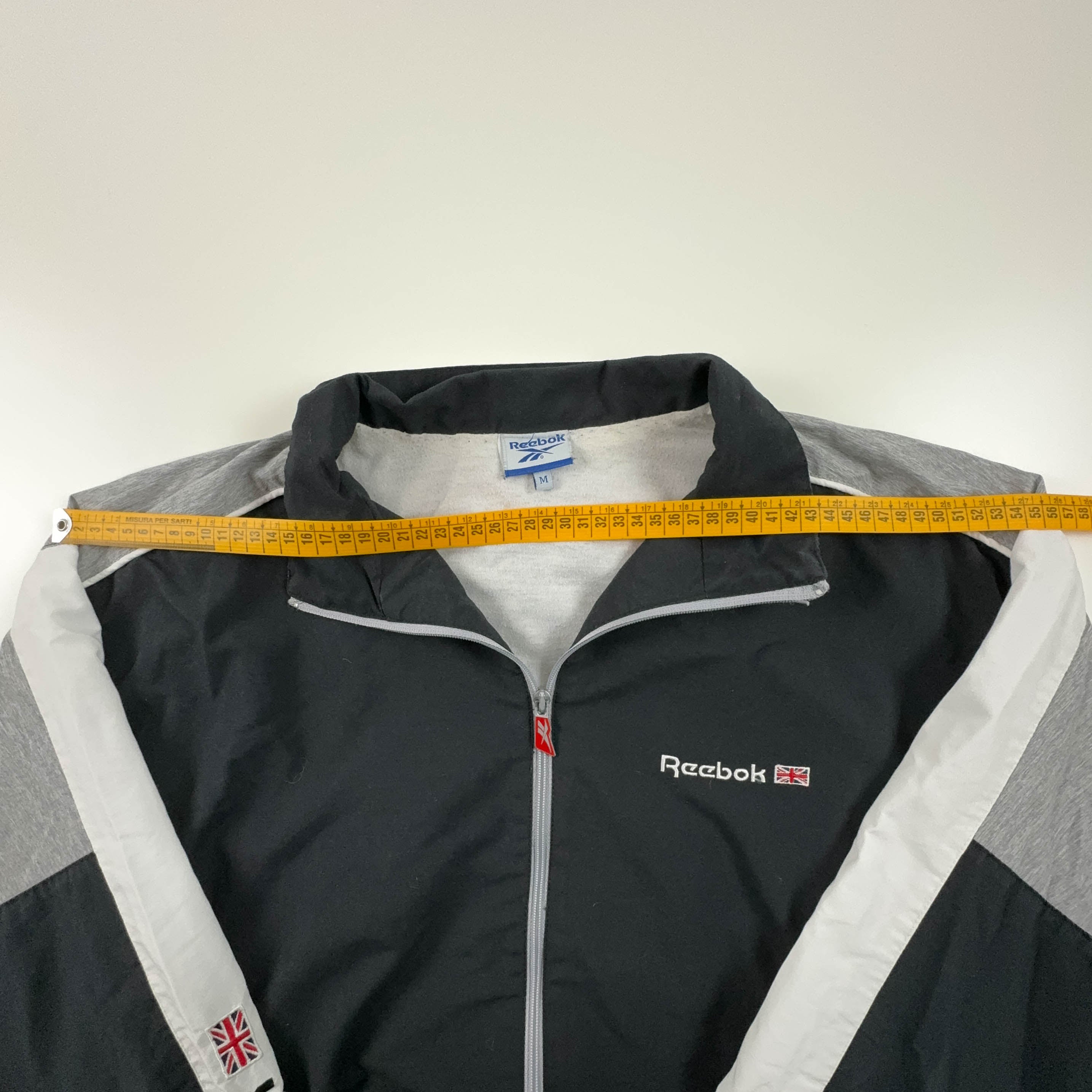 Giacca a vento Reebok Vintage nera e grigia con zip anni 90 - Taglia M uomo