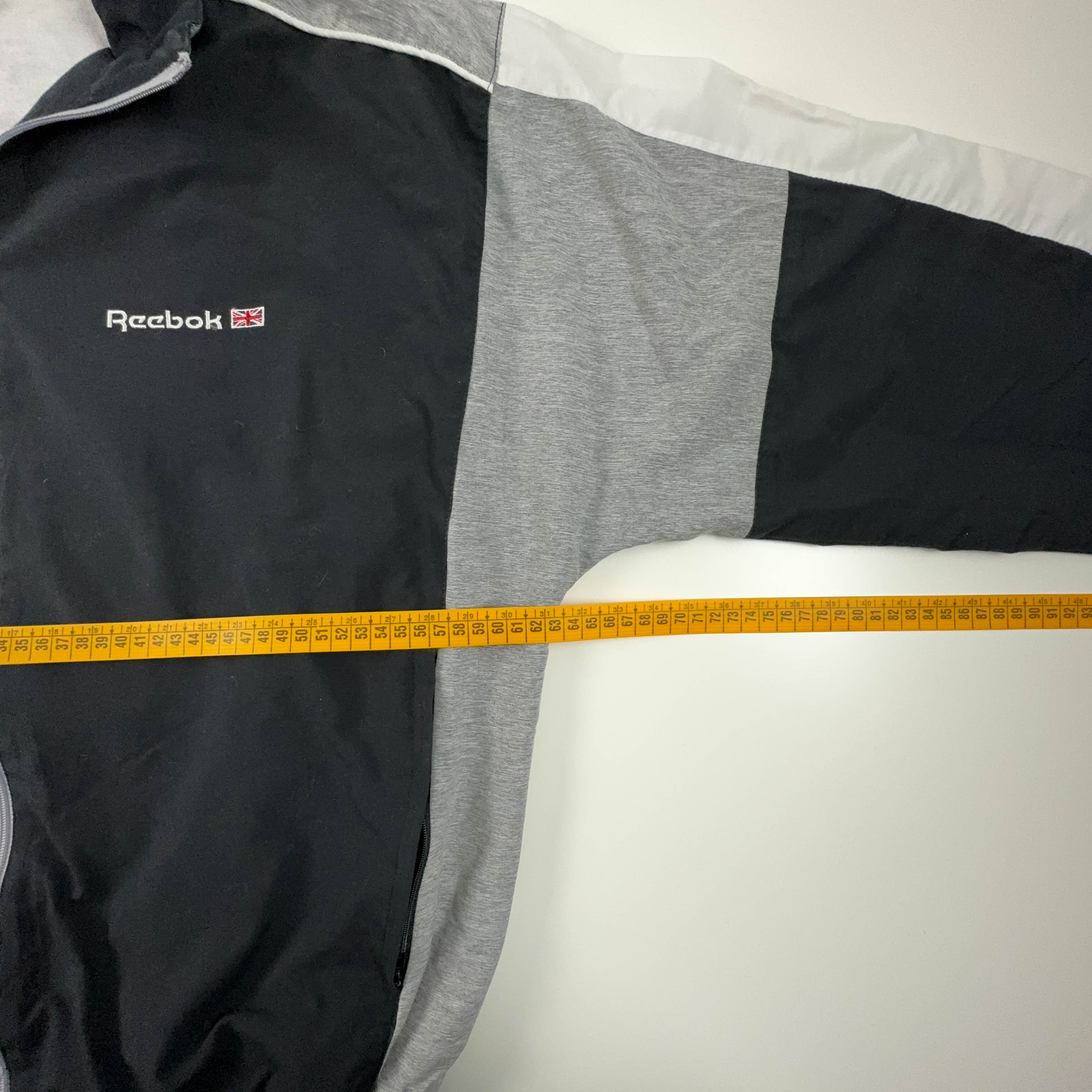 Giacca a vento Reebok Vintage nera e grigia con zip anni 90 - Taglia M uomo