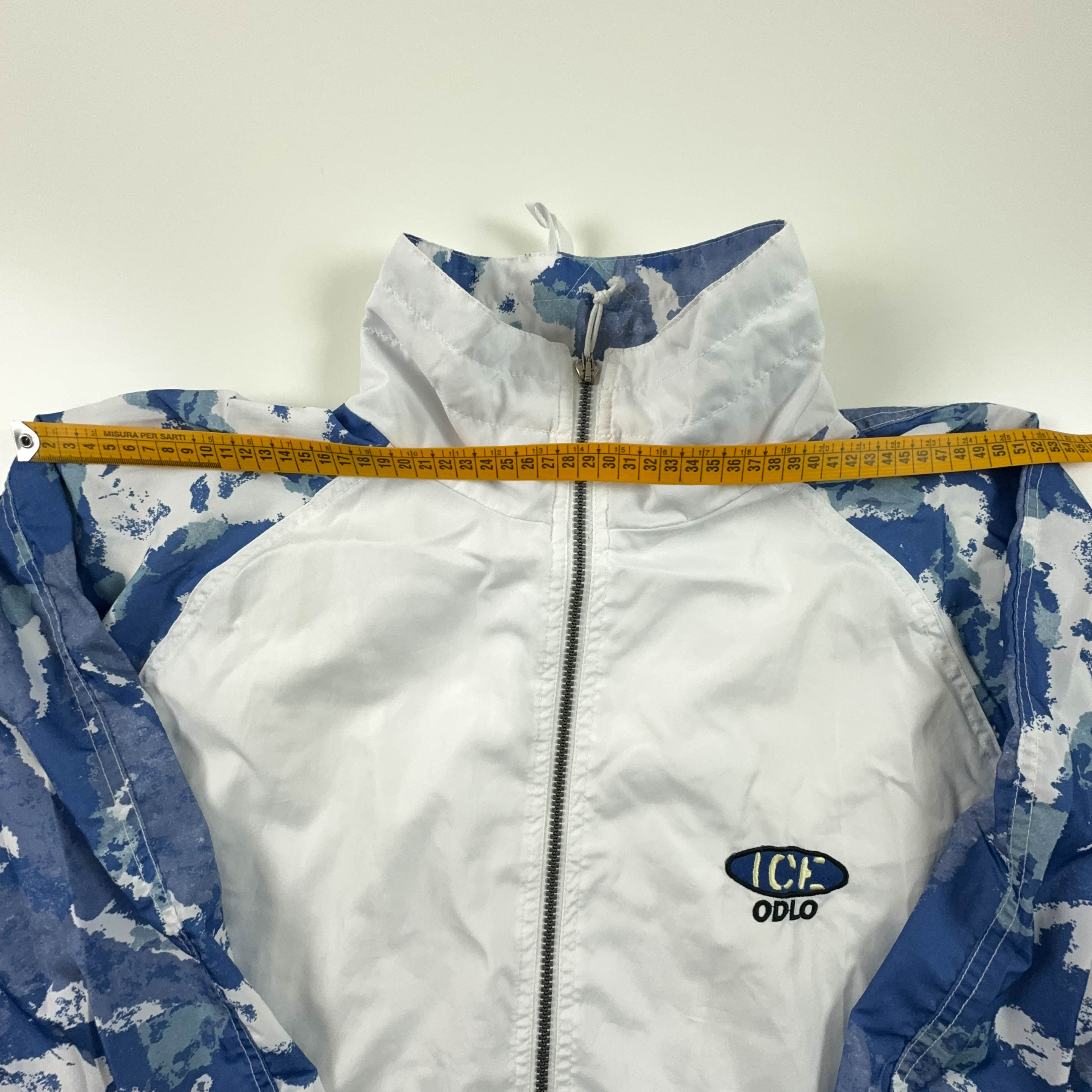 Giacca a vento Vintage bianca e blu a fantasia con zip anni 90 - Taglia XL uomo
