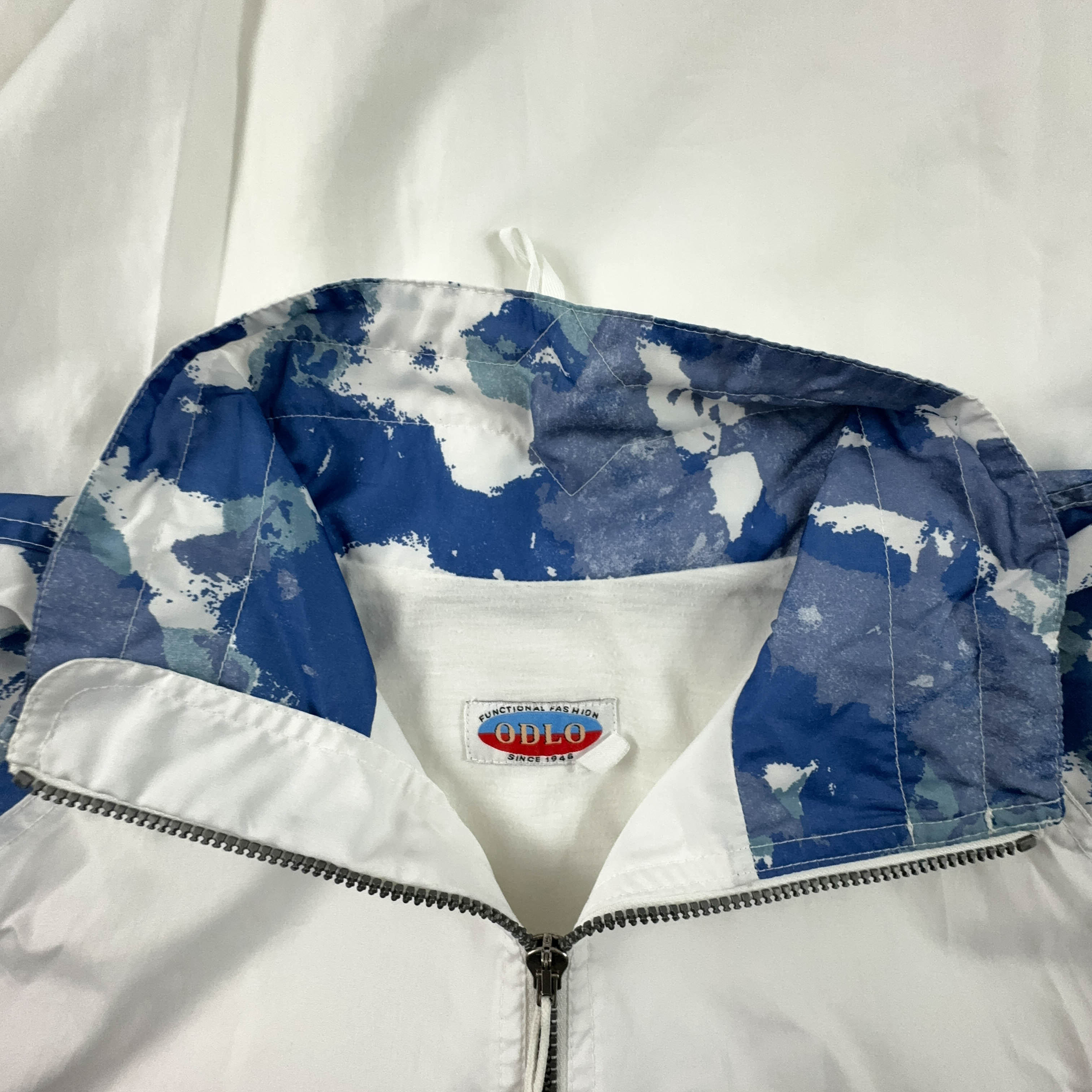 Giacca a vento Vintage bianca e blu a fantasia con zip anni 90 - Taglia XL uomo
