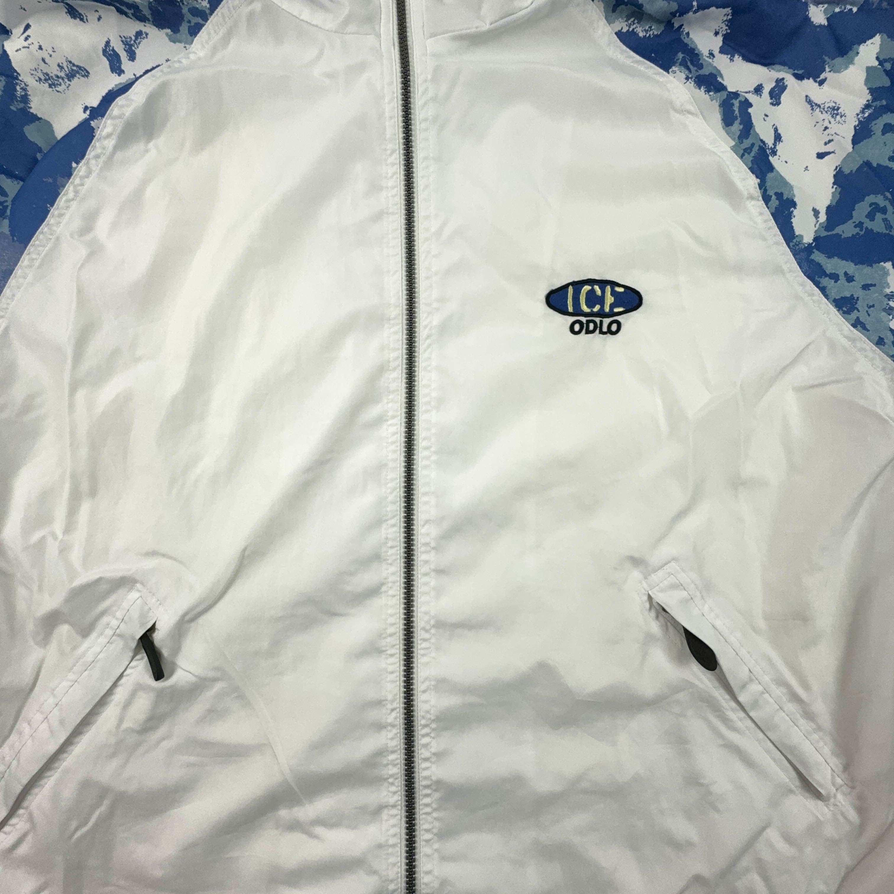 Giacca a vento Vintage bianca e blu a fantasia con zip anni 90 - Taglia XL uomo