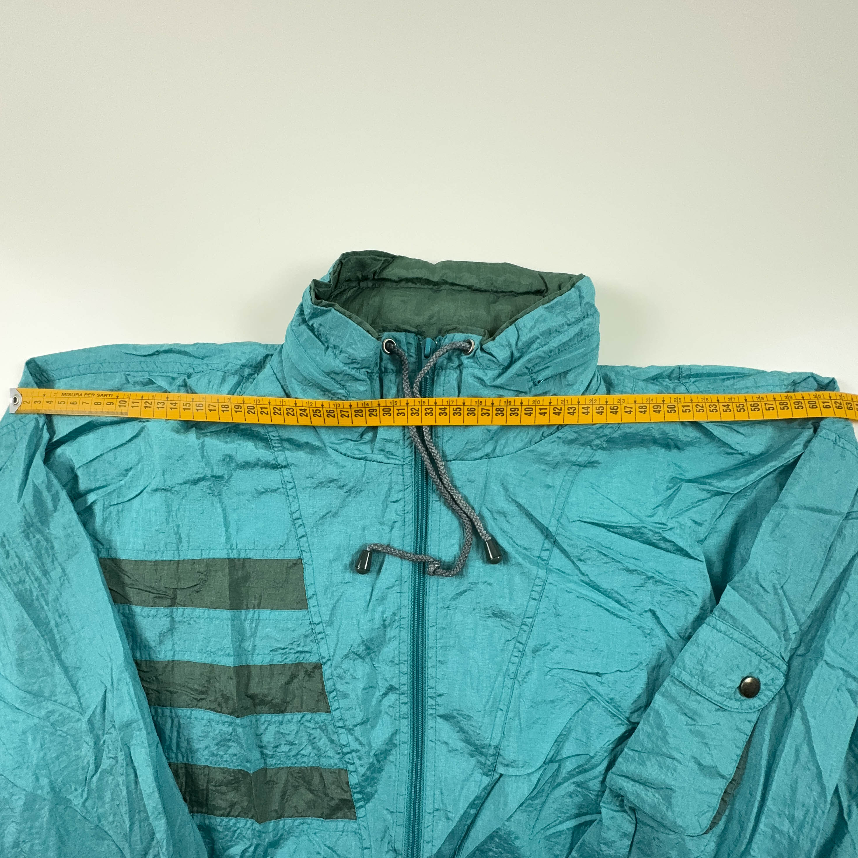 Giacca a vento Vintage azzurra con zip e cappuccio anni 90 - Taglia L uomo