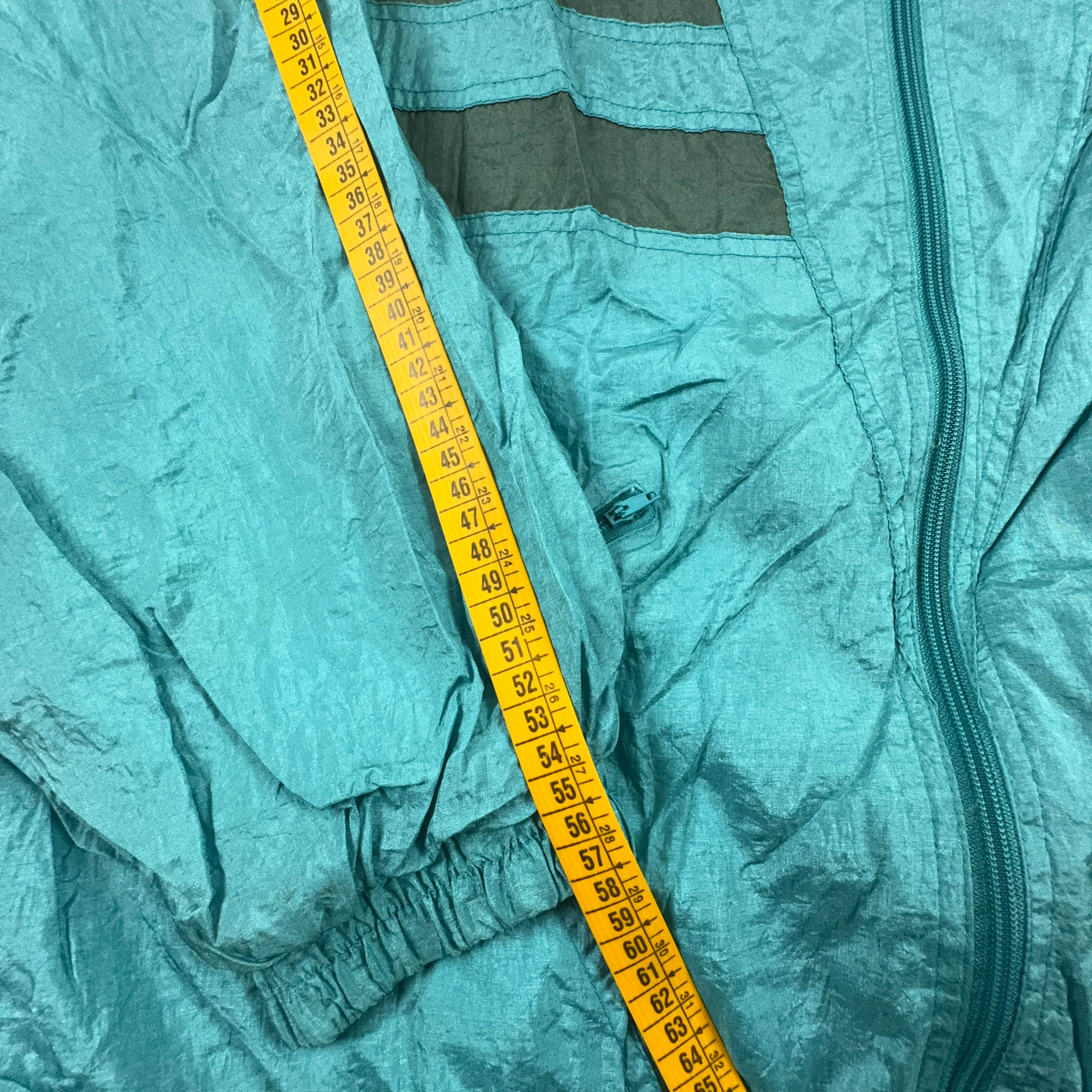 Giacca a vento Vintage azzurra con zip e cappuccio anni 90 - Taglia L uomo