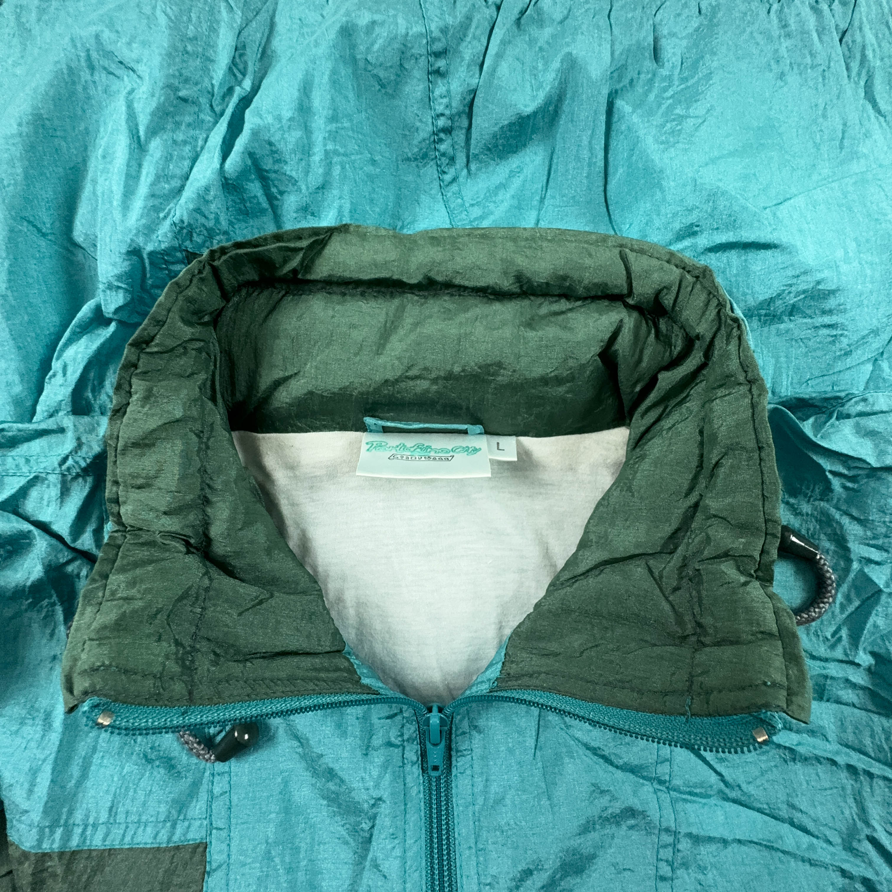 Giacca a vento Vintage azzurra con zip e cappuccio anni 90 - Taglia L uomo