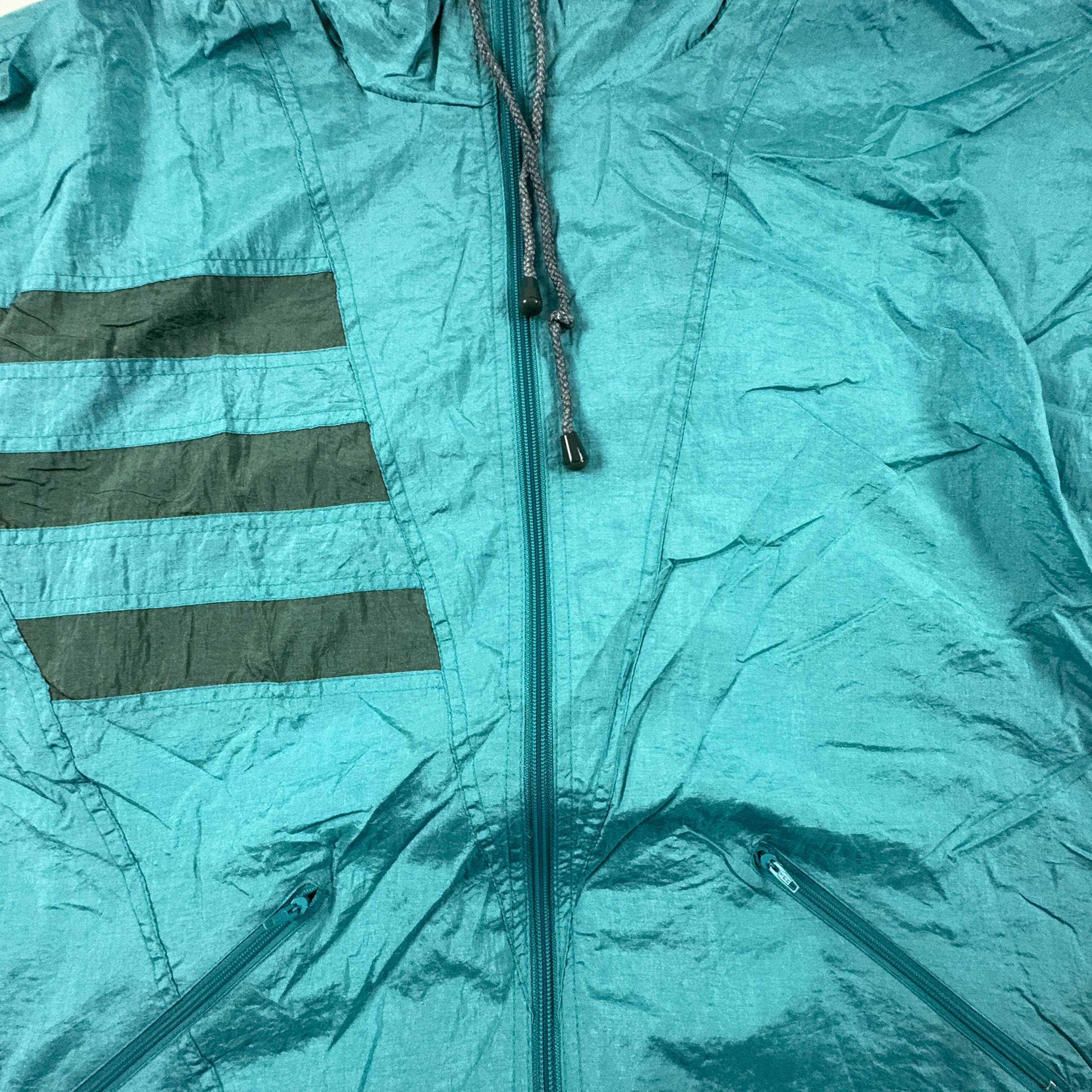 Giacca a vento Vintage azzurra con zip e cappuccio anni 90 - Taglia L uomo
