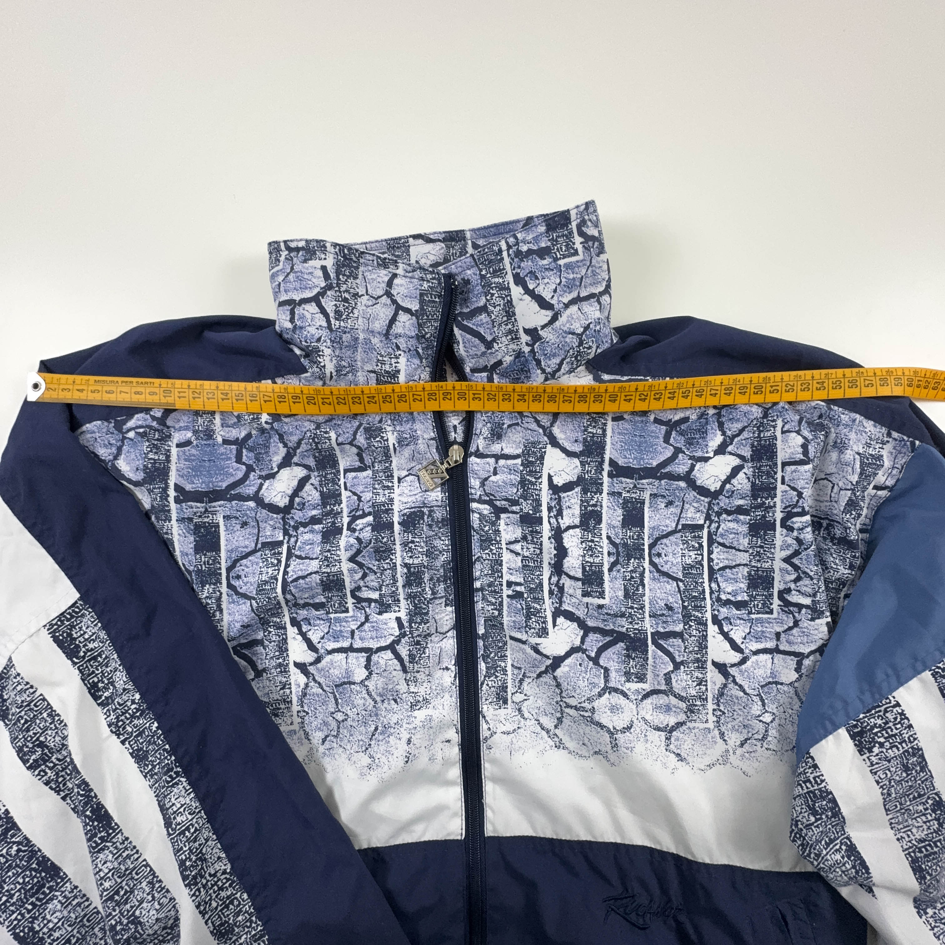 Giacca a vento Vintage blu e bianca a fantasia anni 90 - Taglia L/XL uomo