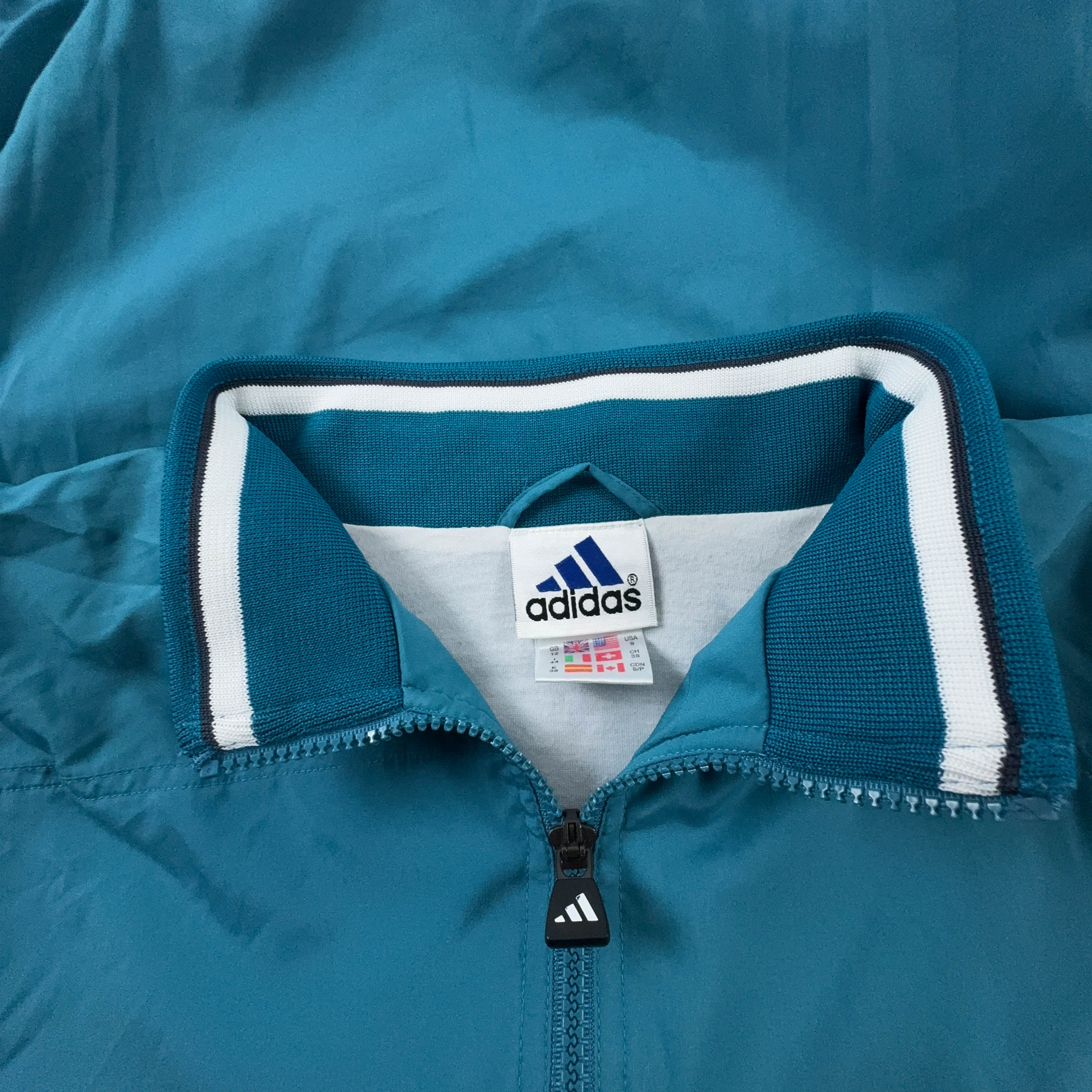 Giacca a vento Adidas Vintage azzurra con zip anni 90 - Taglia 44 uomo