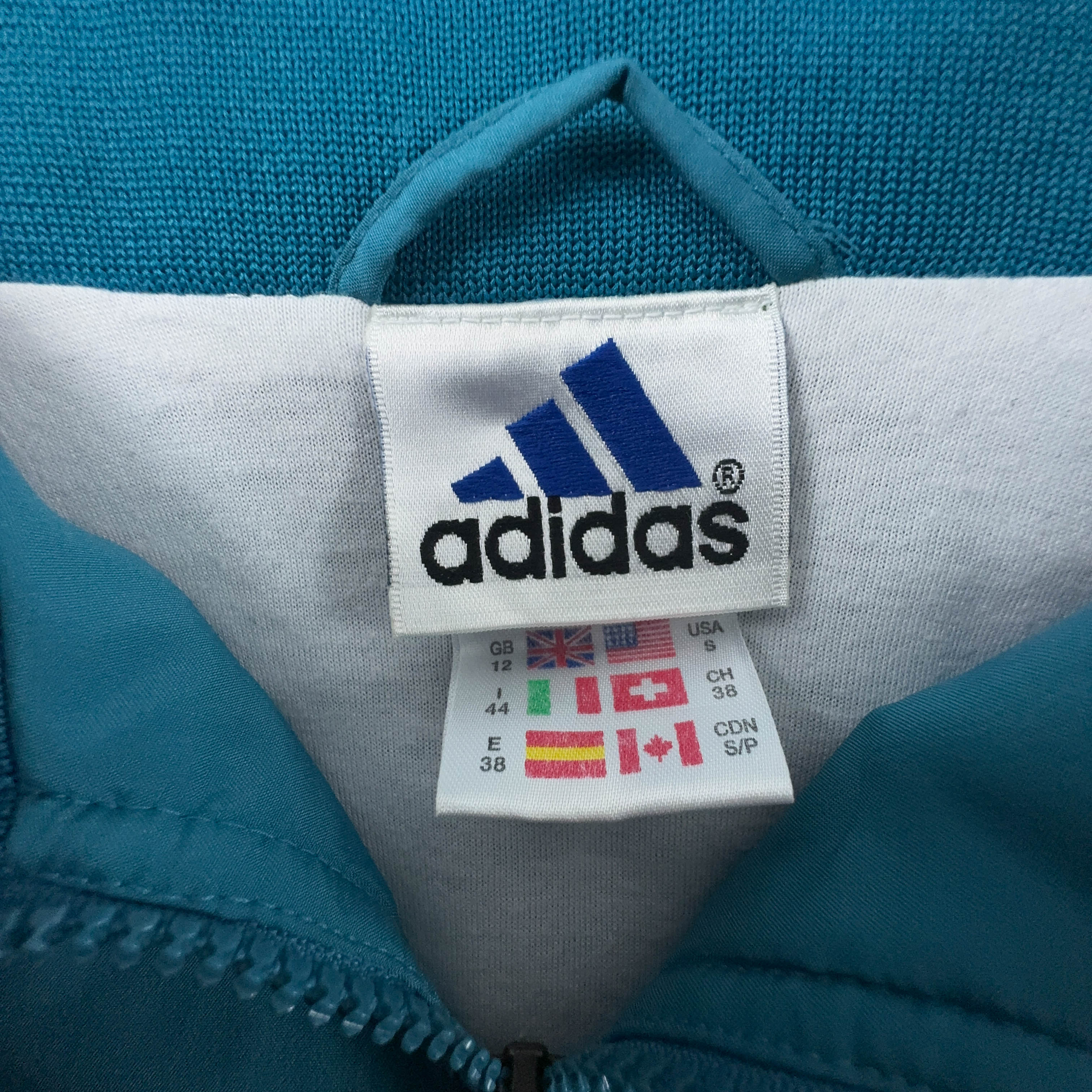 Giacca a vento Adidas Vintage azzurra con zip anni 90 - Taglia 44 uomo
