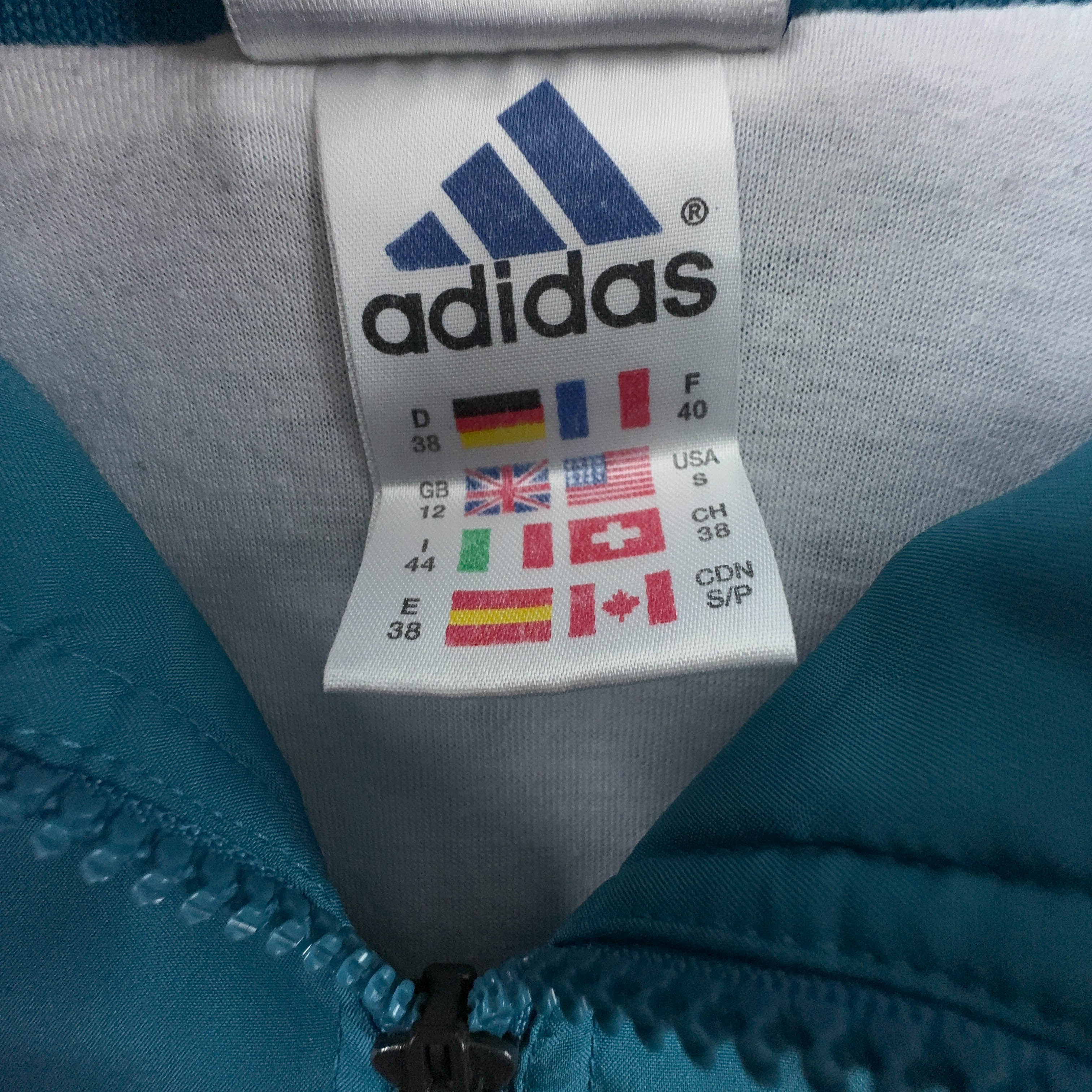 Giacca a vento Adidas Vintage azzurra con zip anni 90 - Taglia 44 uomo