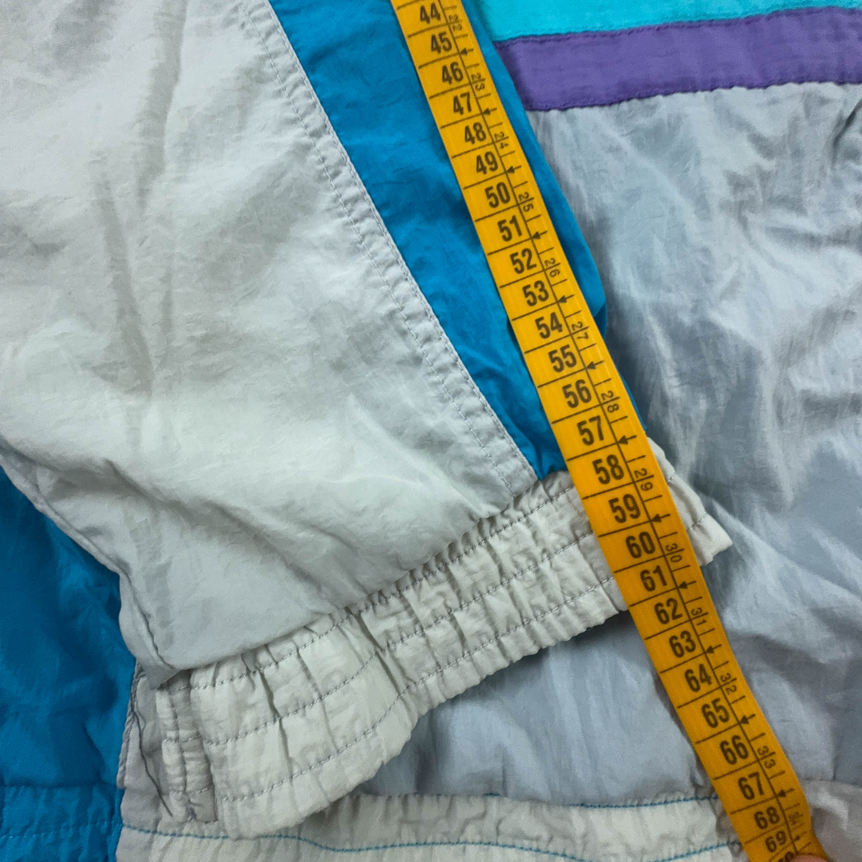 Giacca a vento Lotto Vintage bianca e azzurra con ricamo e zip anni 90 - Taglia XL uomo