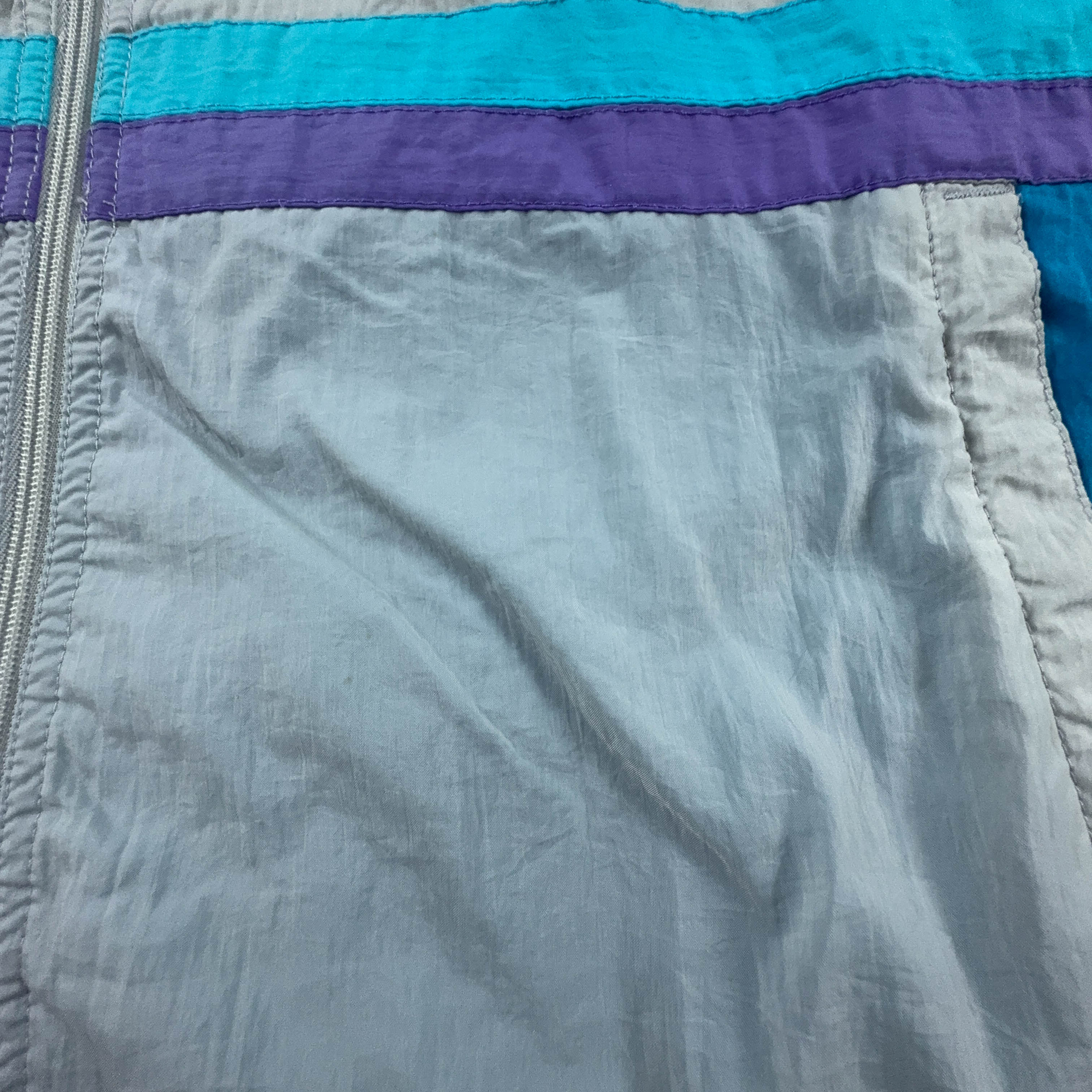 Giacca a vento Lotto Vintage bianca e azzurra con ricamo e zip anni 90 - Taglia XL uomo