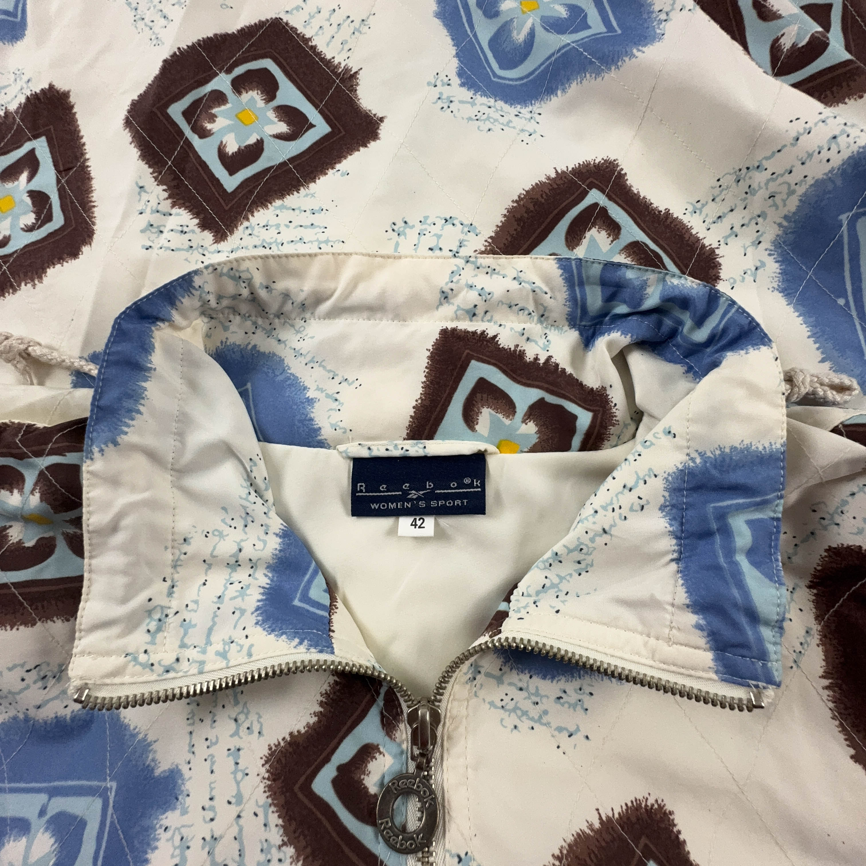 Giacca a vento Reebok Vintage crema con fantasia all over e zip anni 00 - Taglia 42 donna