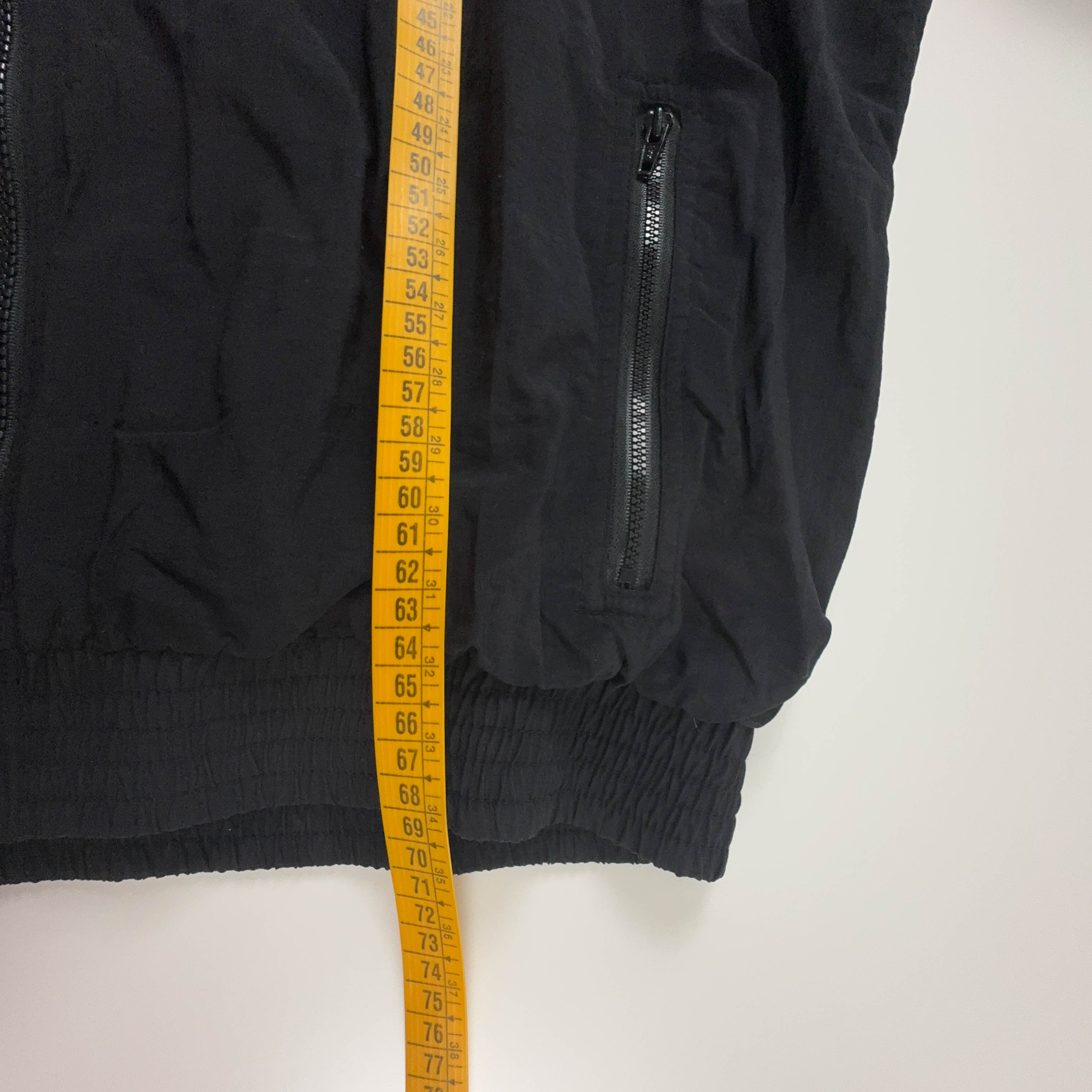Giacca a vento Erima Vintage nera e bianca con fantasia a strisce e zip anni 90 - Taglia 7 uomo