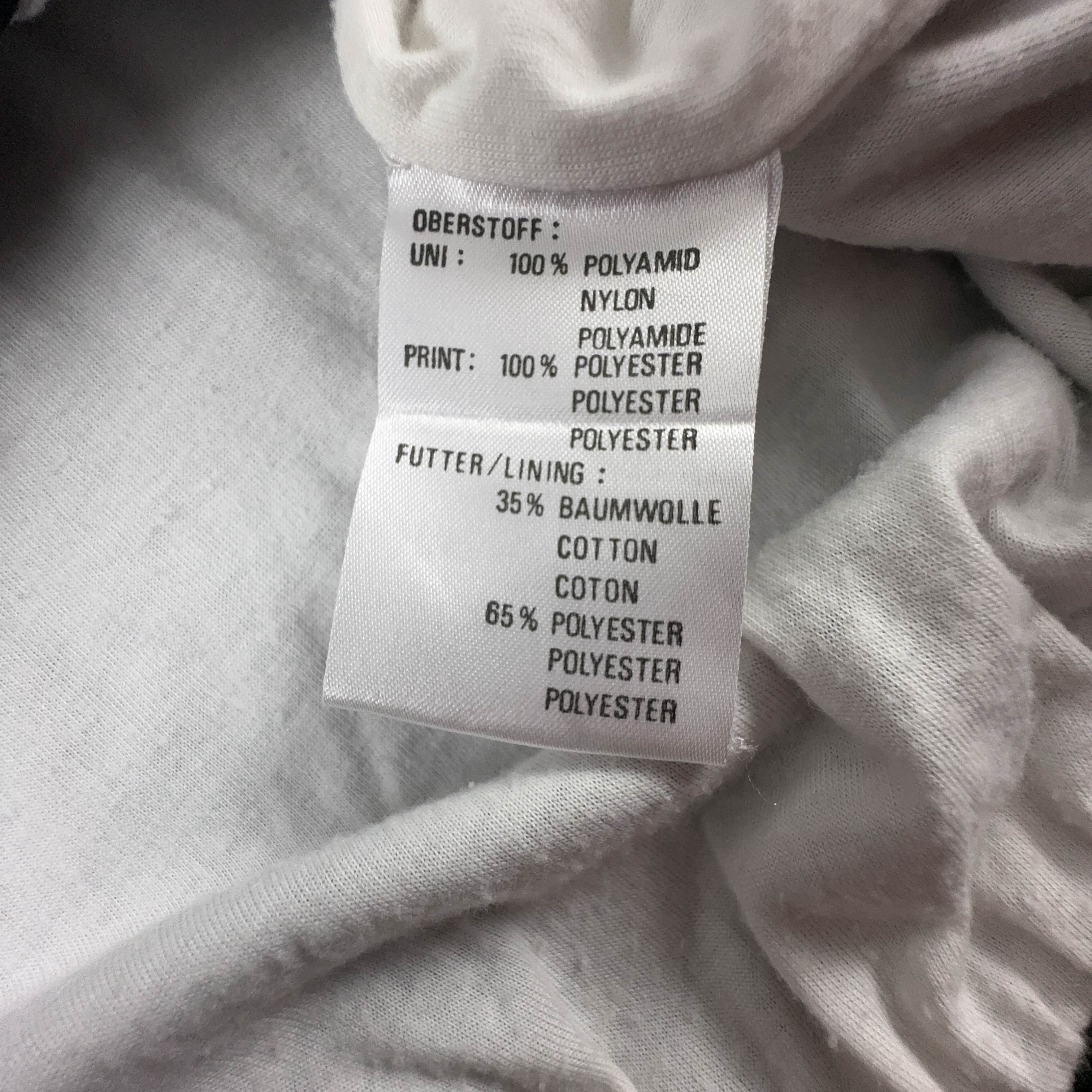 Giacca a vento Erima Vintage nera e bianca con fantasia a strisce e zip anni 90 - Taglia 7 uomo