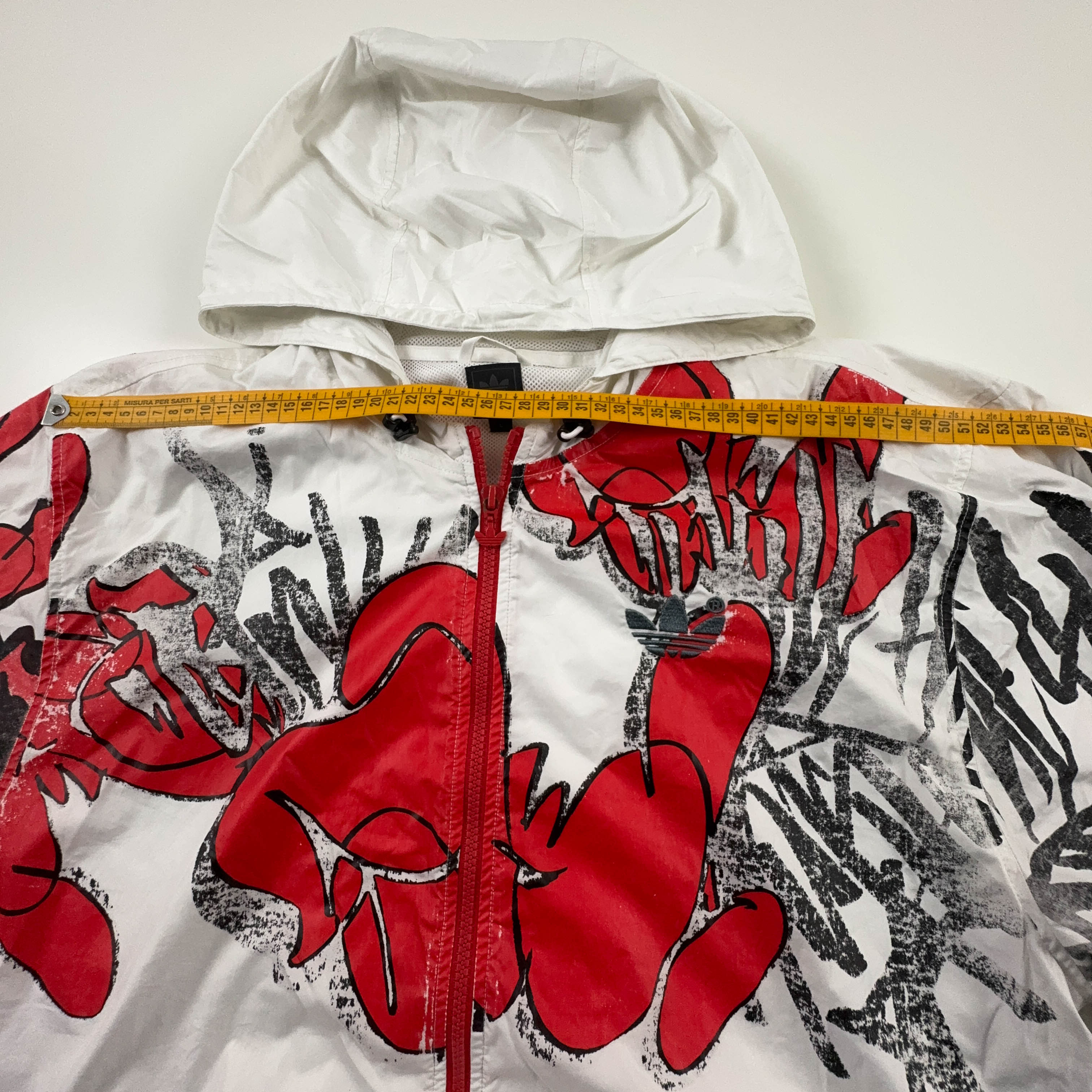 Giacca a vento Adidas Vintage bianca con stampa all over e zip anni 00 - Taglia L uomo