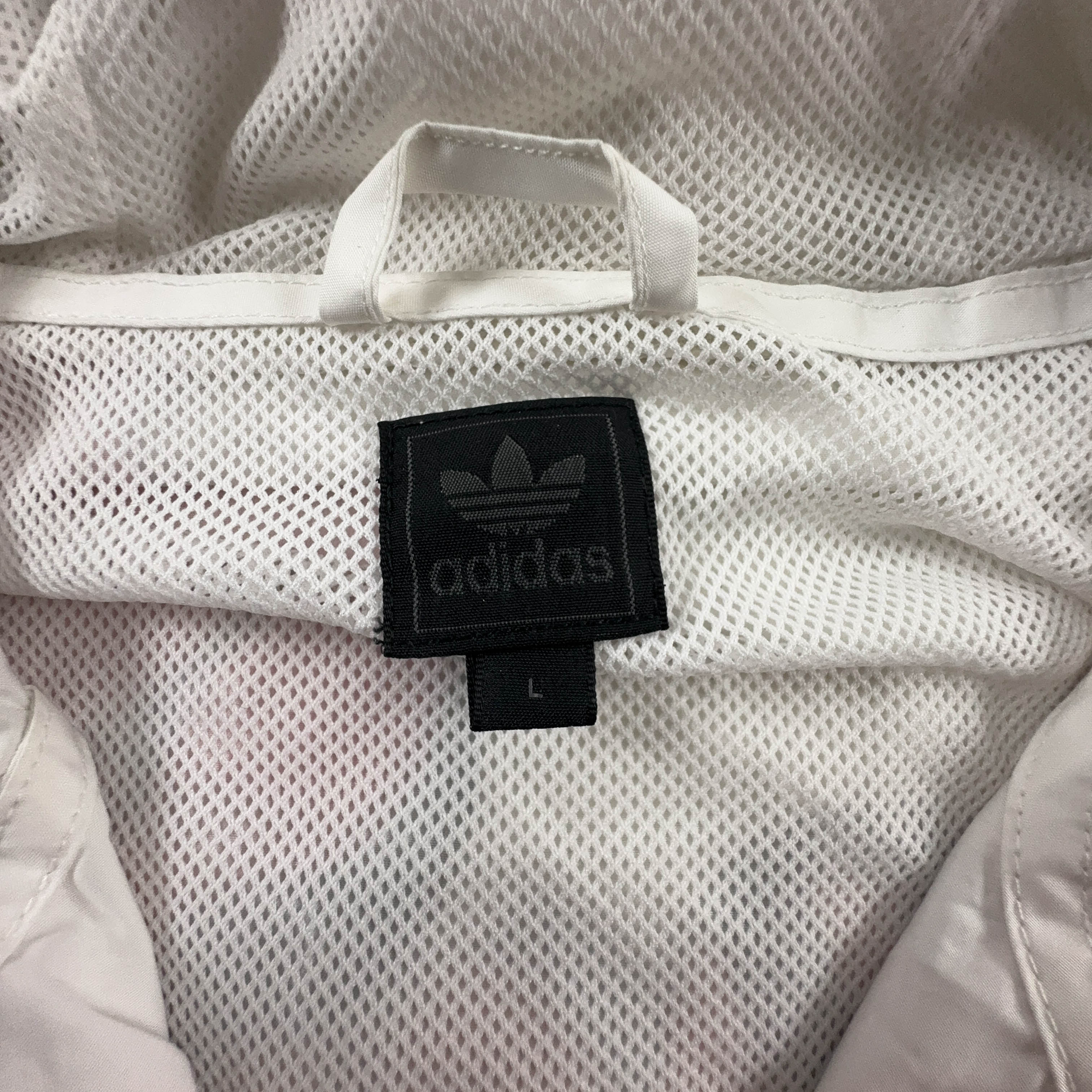 Giacca a vento Adidas Vintage bianca con stampa all over e zip anni 00 - Taglia L uomo