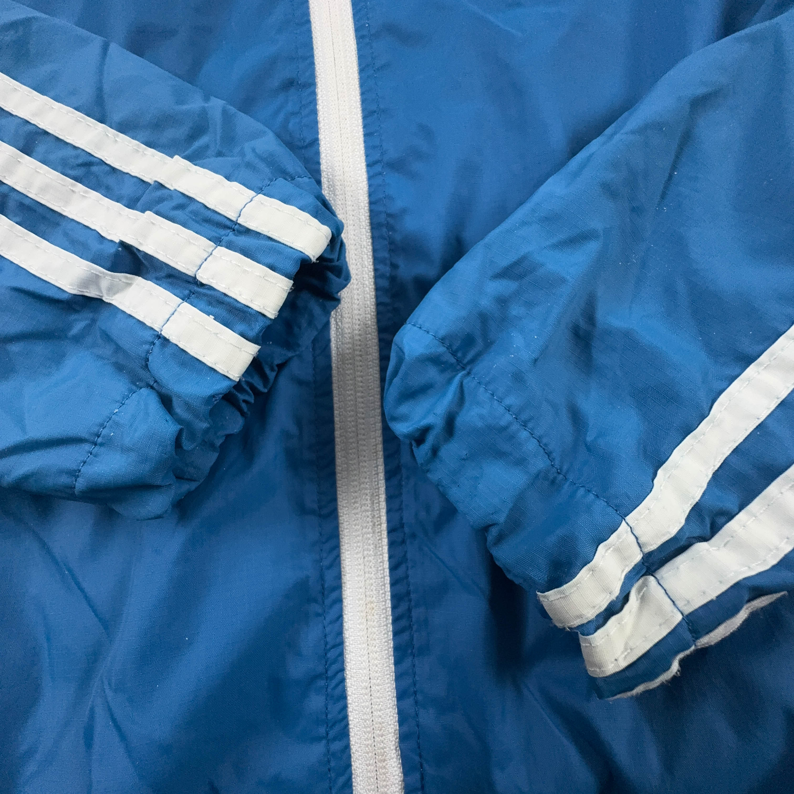 Giacca a vento Adidas azzurra e bianca con zip - Taglia L uomo