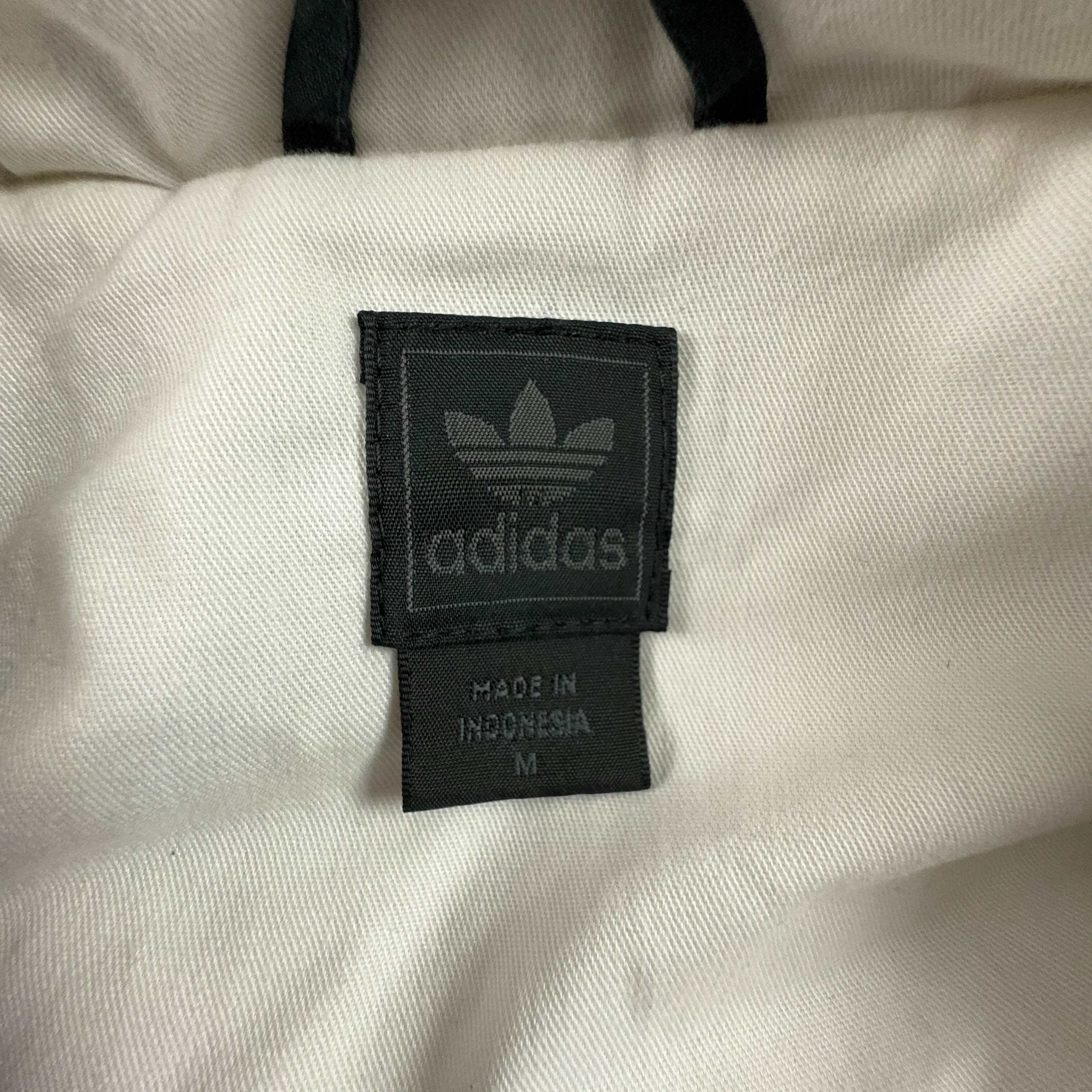 Giubbotto Adidas Vintage nero anni 2000 lungo con zip e cappuccio - Taglia M/L uomo